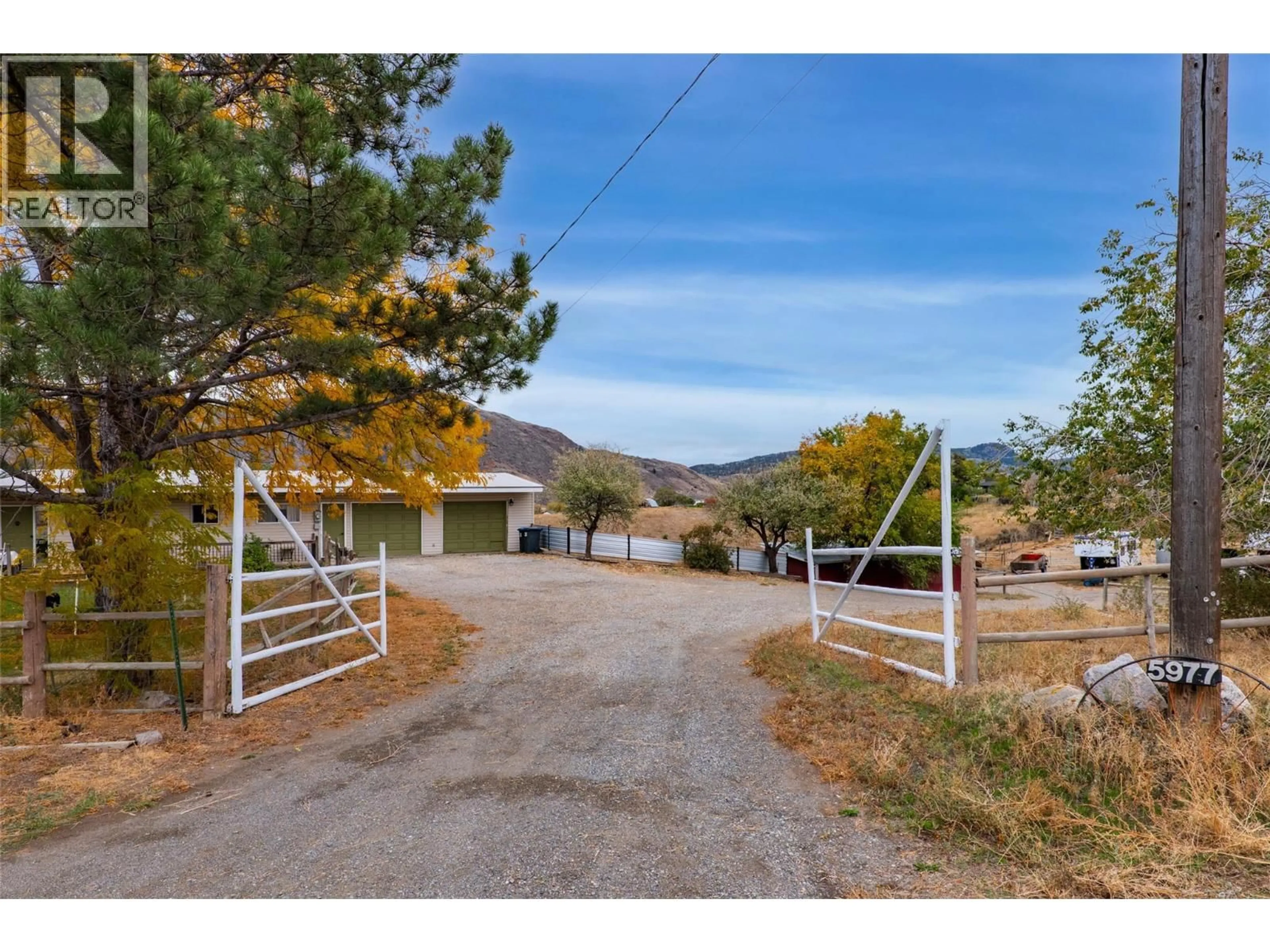 A pic from outside/outdoor area/front of a property/back of a property/a pic from drone, mountain view for 5977 GARDI ROAD, Kamloops British Columbia V1S2A1