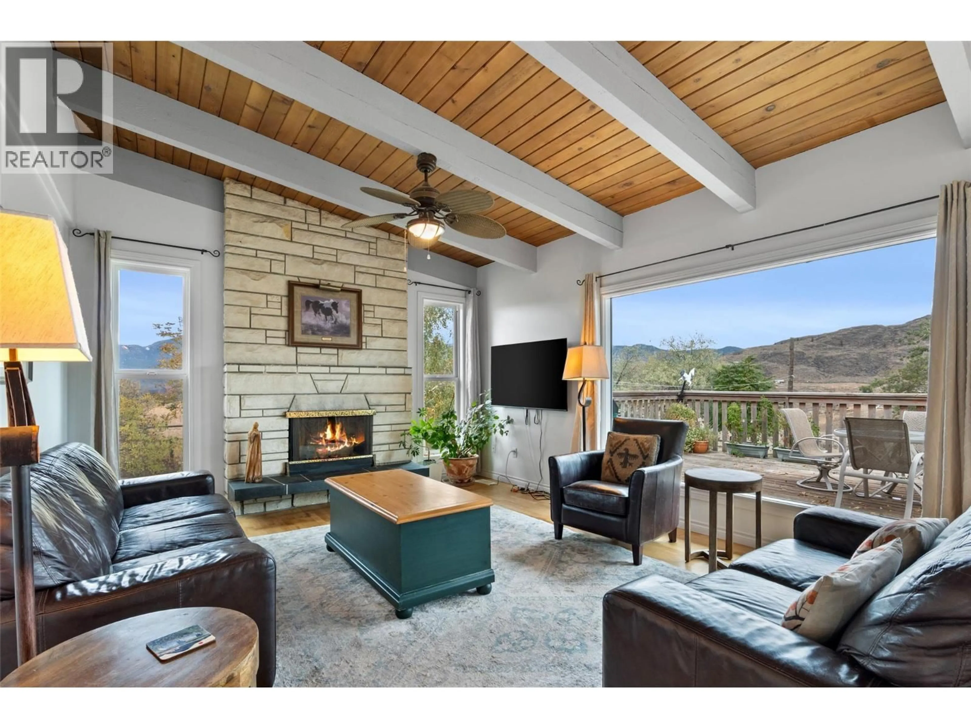Living room with furniture, wood/laminate floor for 5977 GARDI ROAD, Kamloops British Columbia V1S2A1