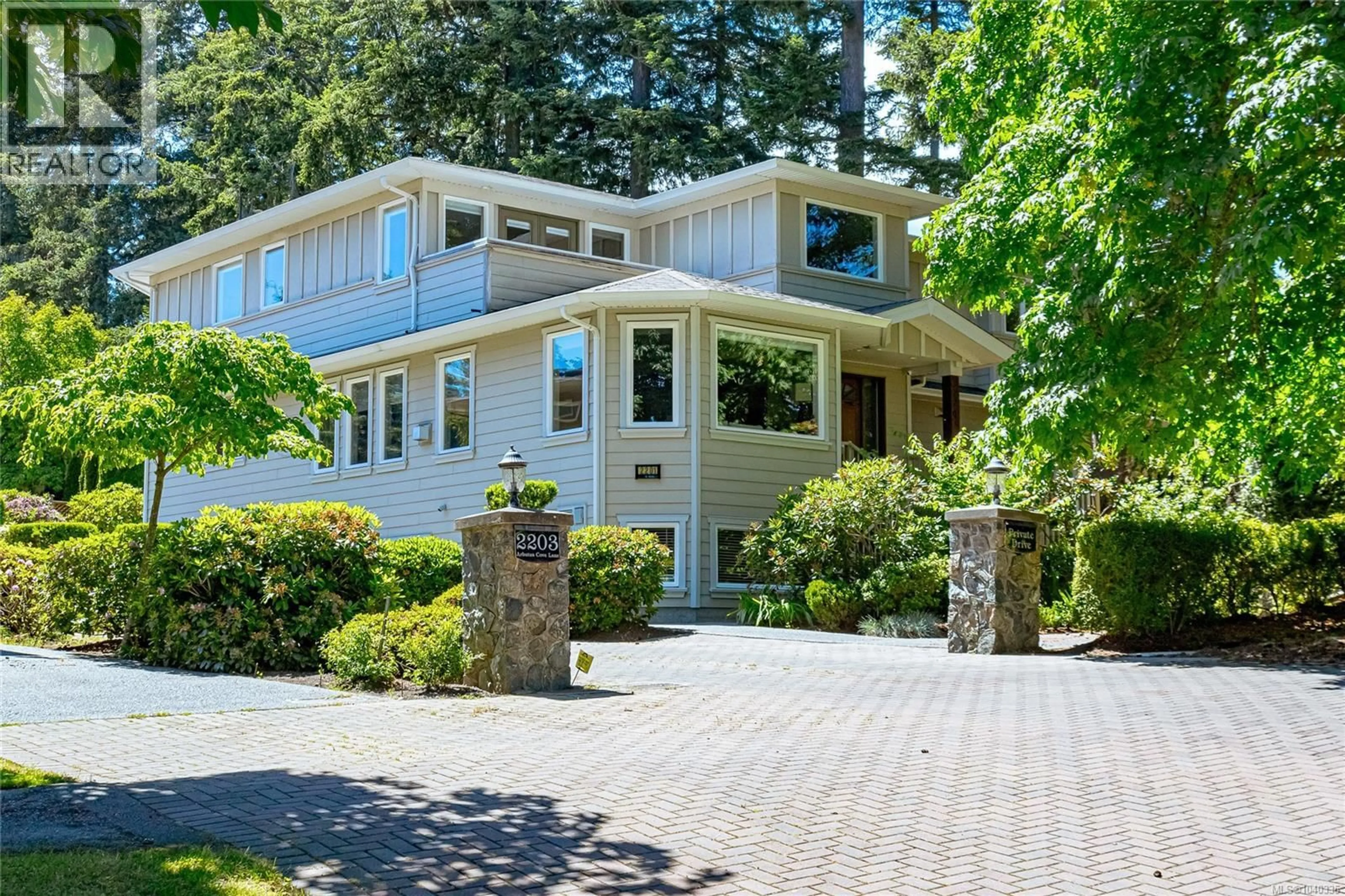 Home with vinyl exterior material, street for 2201 ARBUTUS COVE LANE, Saanich British Columbia V8N6N7