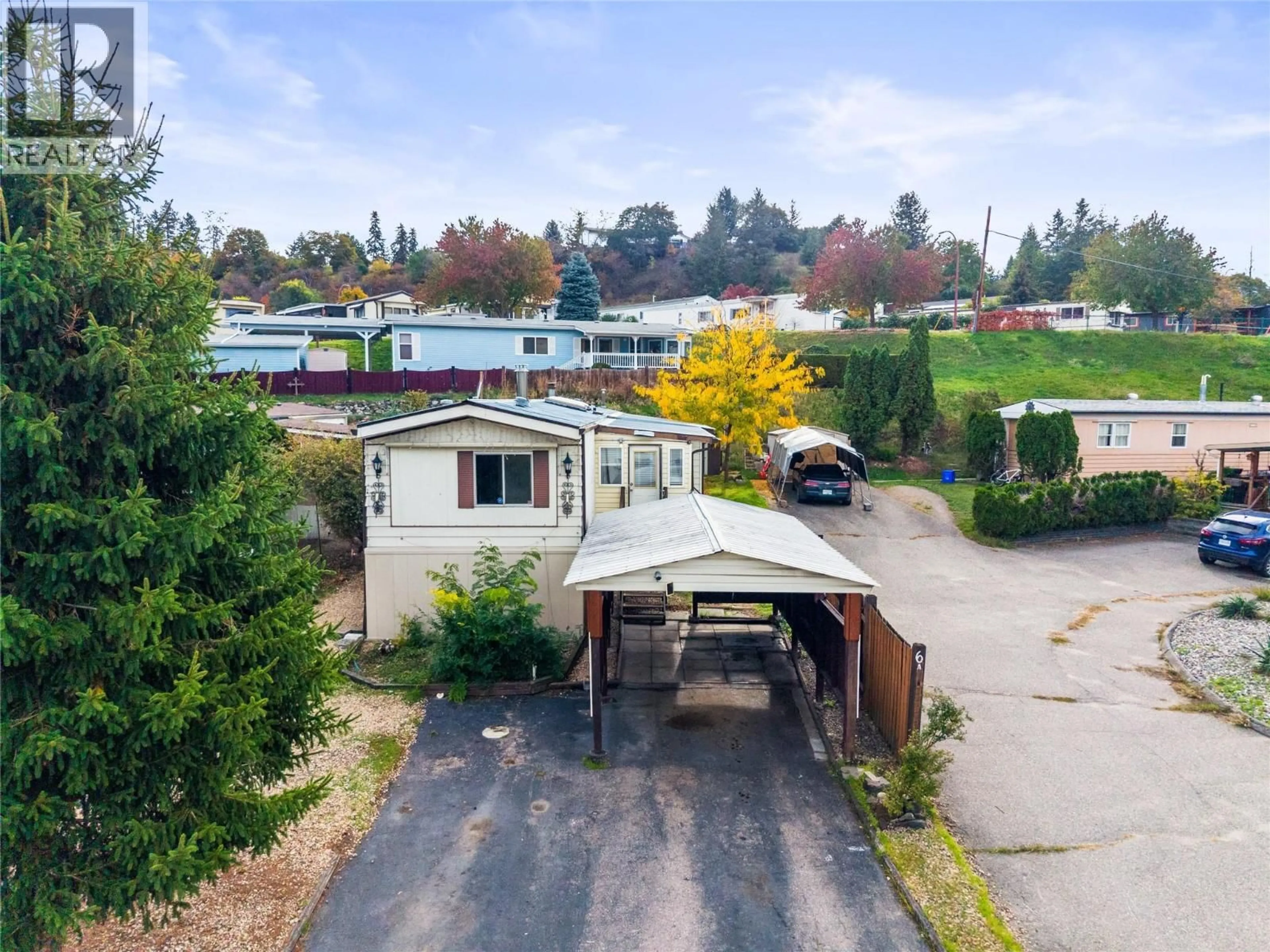 A pic from outside/outdoor area/front of a property/back of a property/a pic from drone, street for 6A - 15401 KALAMALKA ROAD, Coldstream British Columbia V1B1Z3