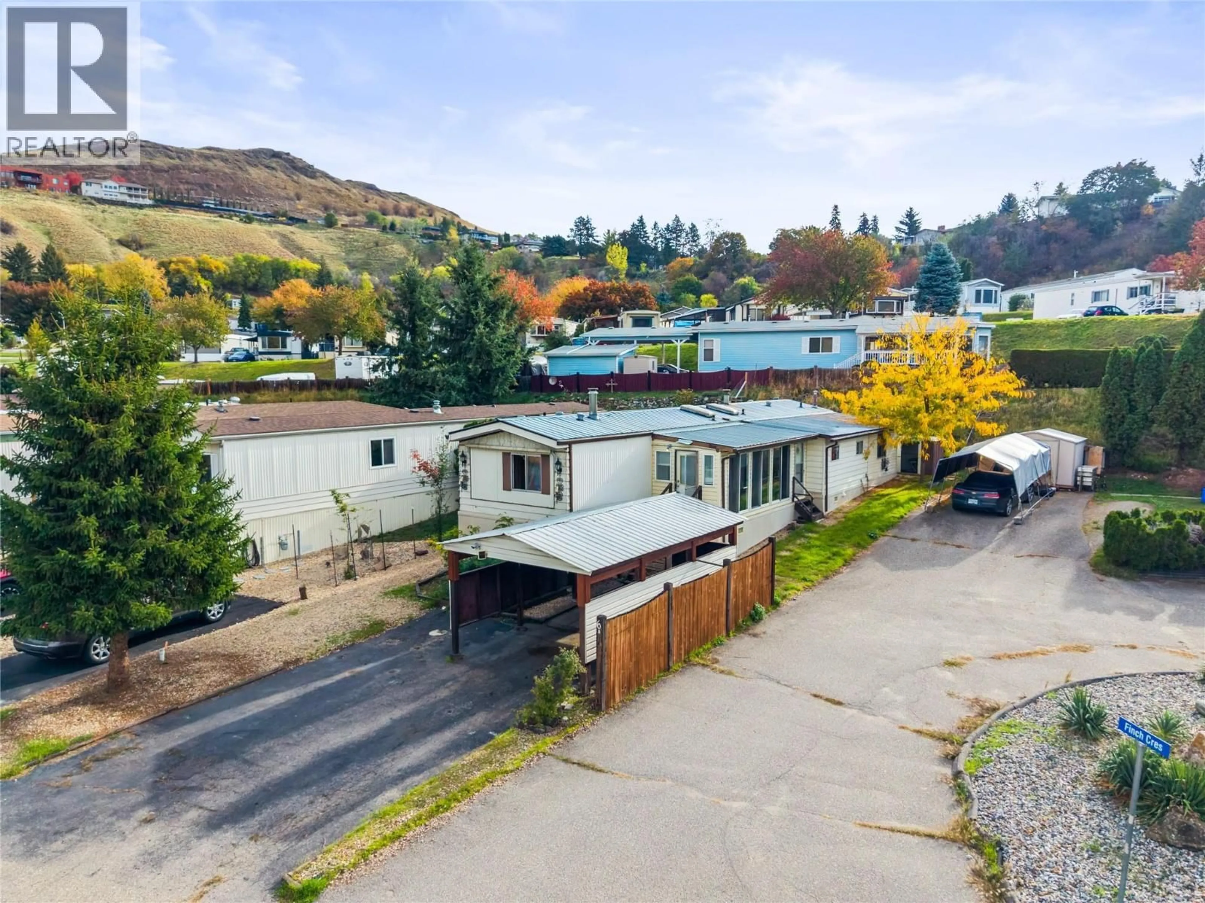 A pic from outside/outdoor area/front of a property/back of a property/a pic from drone, street for 6A - 15401 KALAMALKA ROAD, Coldstream British Columbia V1B1Z3