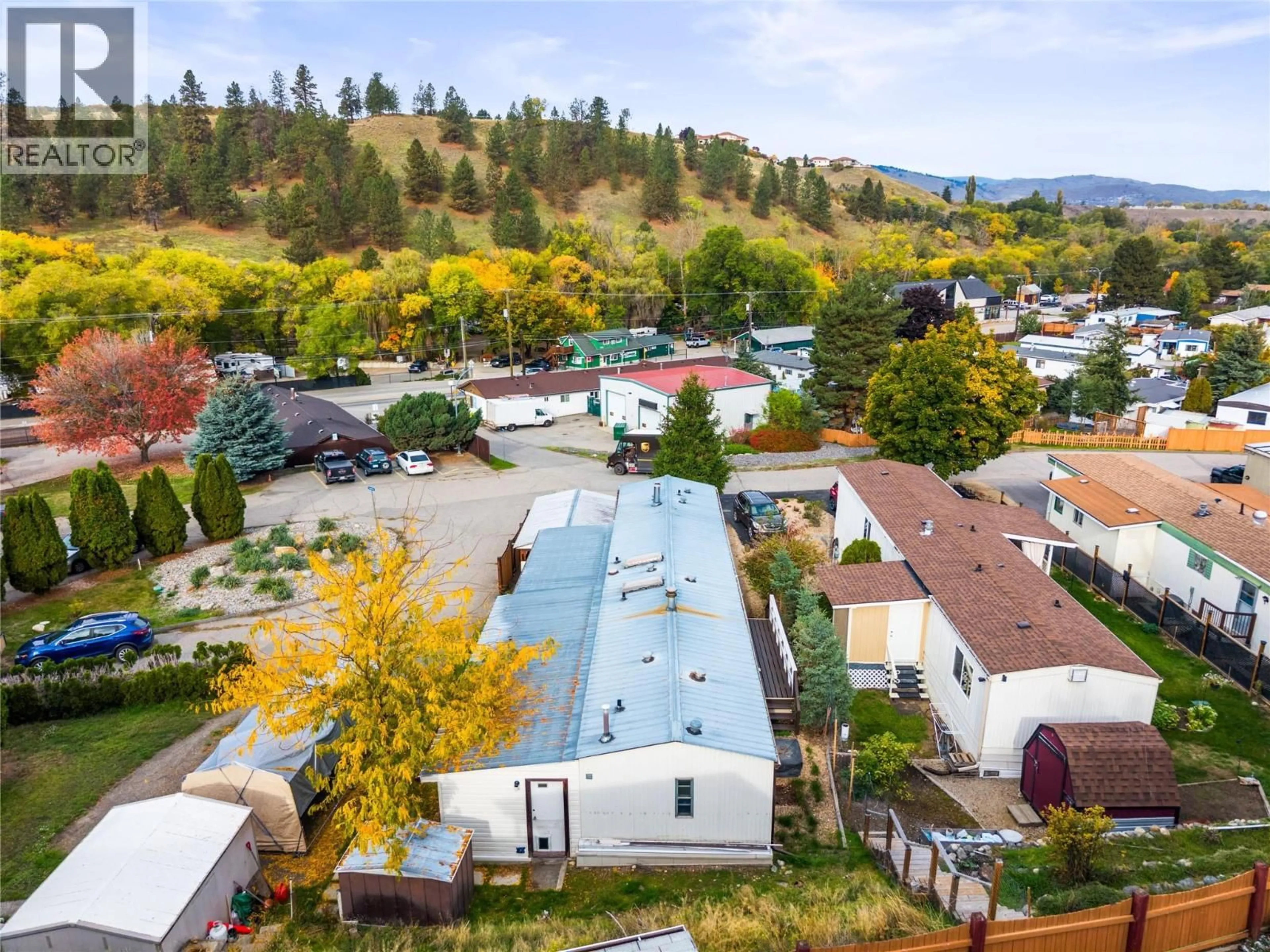 A pic from outside/outdoor area/front of a property/back of a property/a pic from drone, mountain view for 6A - 15401 KALAMALKA ROAD, Coldstream British Columbia V1B1Z3