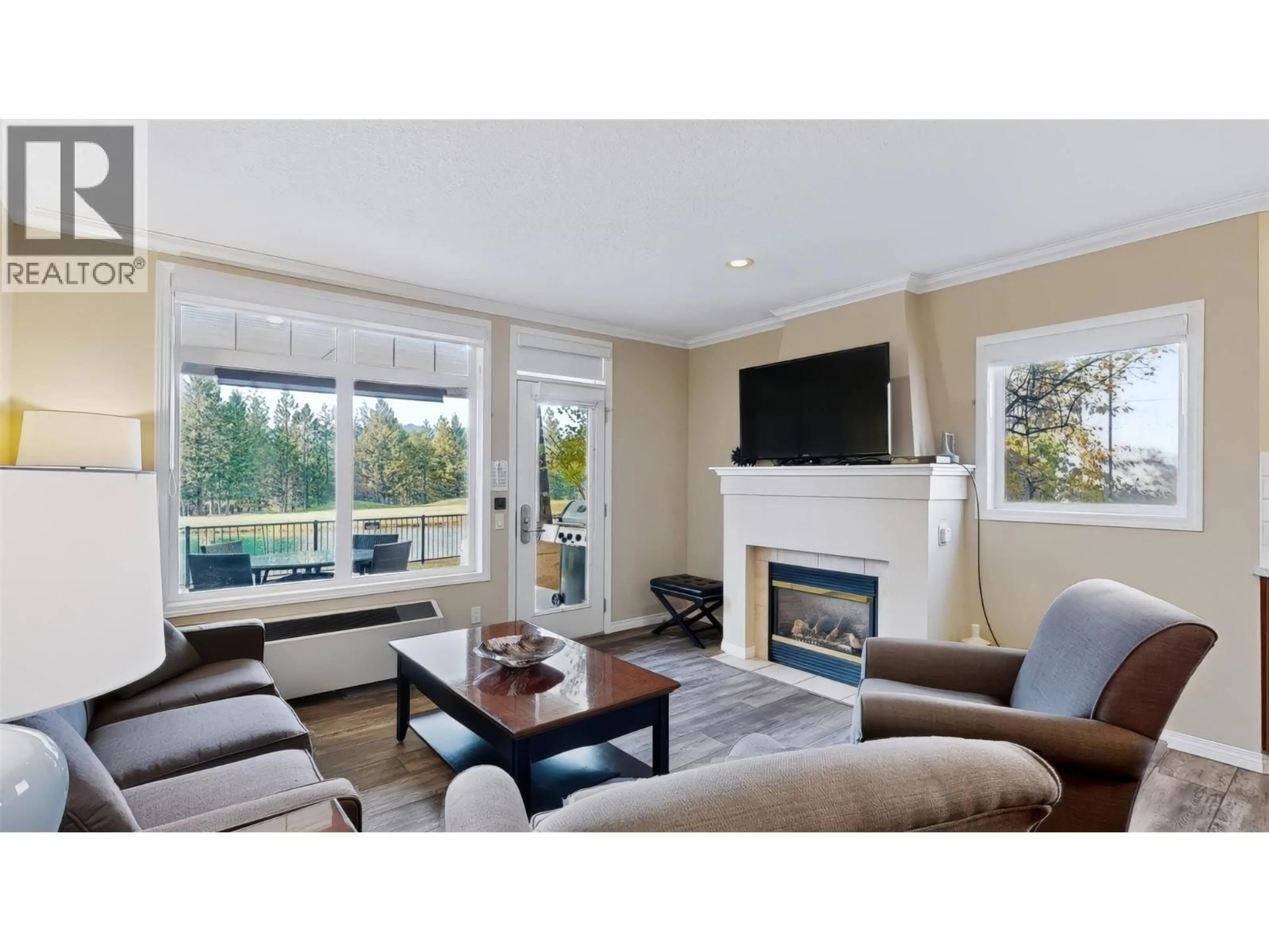 Living room with furniture, wood/laminate floor for 105 B - 100 BIGHORN BOULEVARD, Radium Hot Springs British Columbia V0A1M0