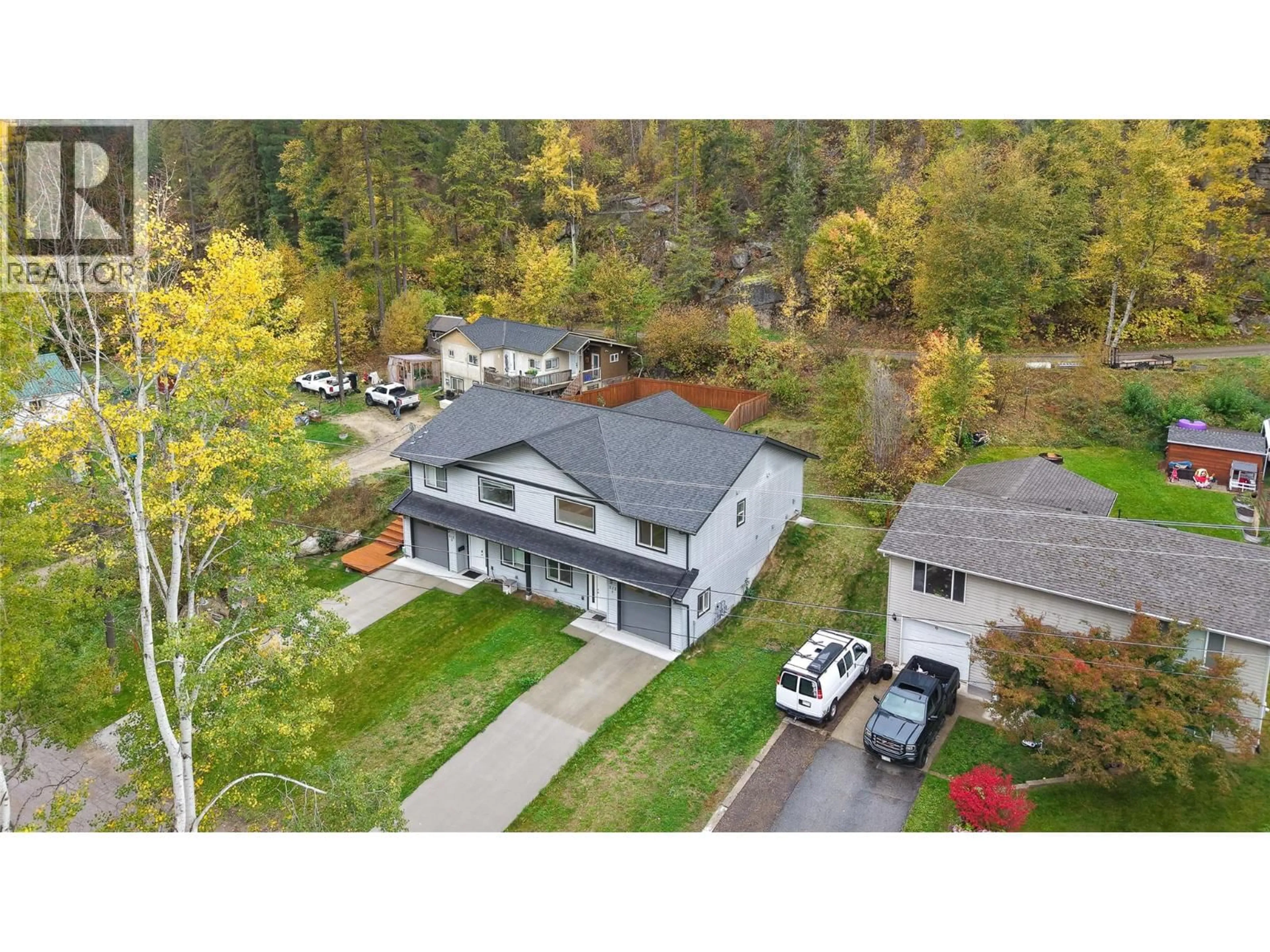 A pic from outside/outdoor area/front of a property/back of a property/a pic from drone, mountain view for 1 - 313 LAKEVIEW STREET, Castlegar British Columbia V1N3Y1