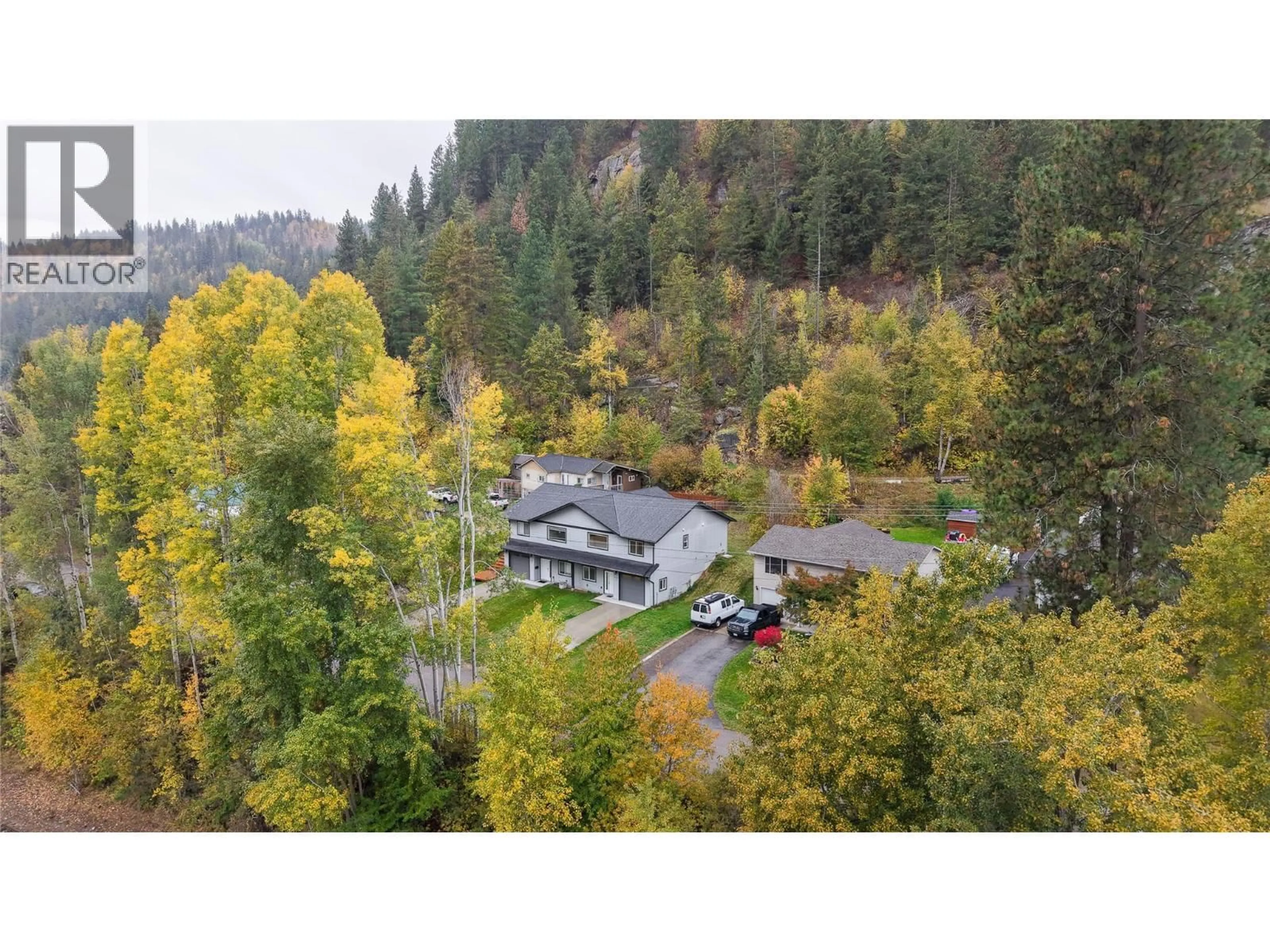 A pic from outside/outdoor area/front of a property/back of a property/a pic from drone, forest/trees view for 1 - 313 LAKEVIEW STREET, Castlegar British Columbia V1N3Y1