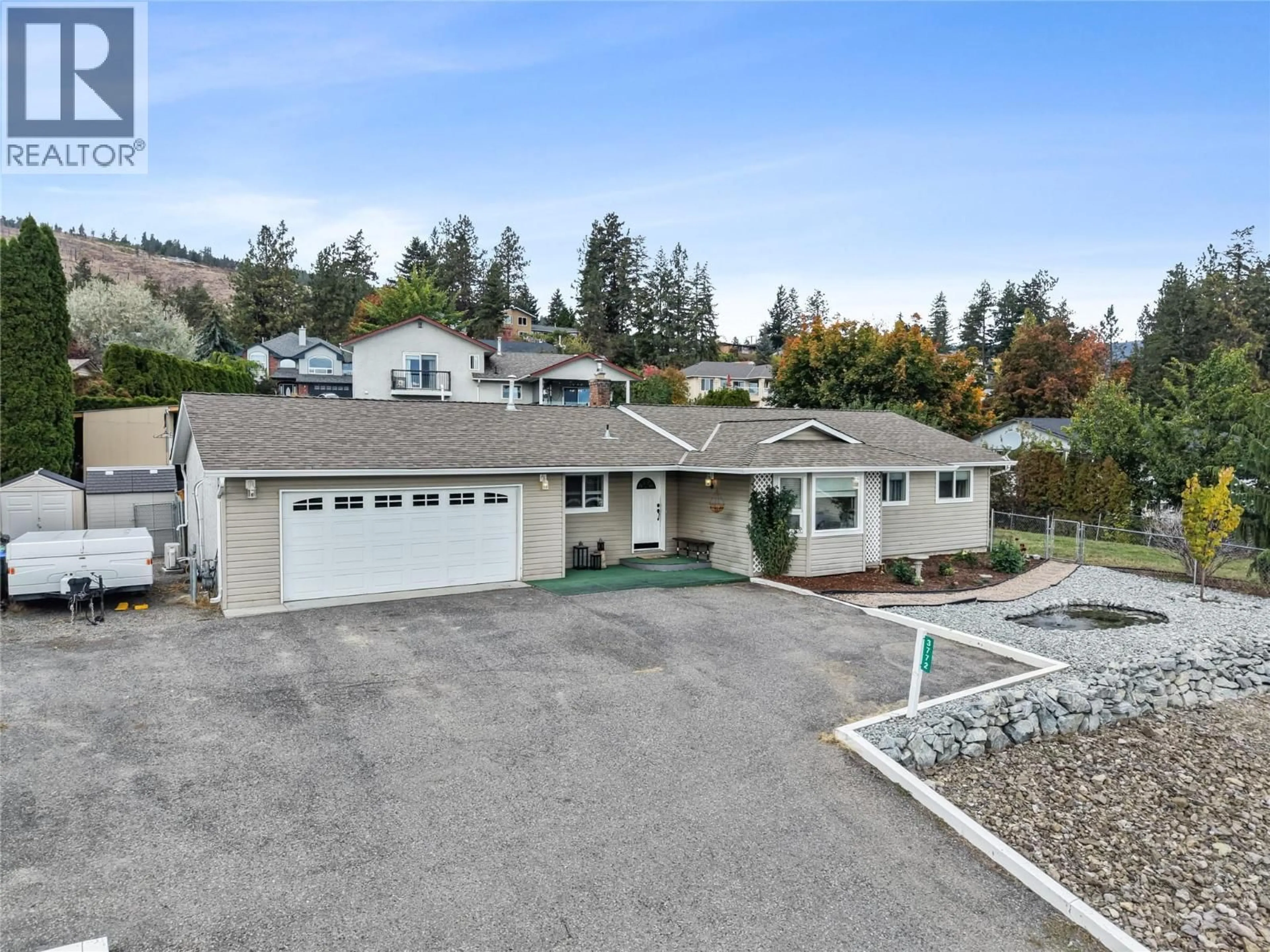 A pic from outside/outdoor area/front of a property/back of a property/a pic from drone, street for 3772 GLENWAY ROAD, West Kelowna British Columbia V4T1E3