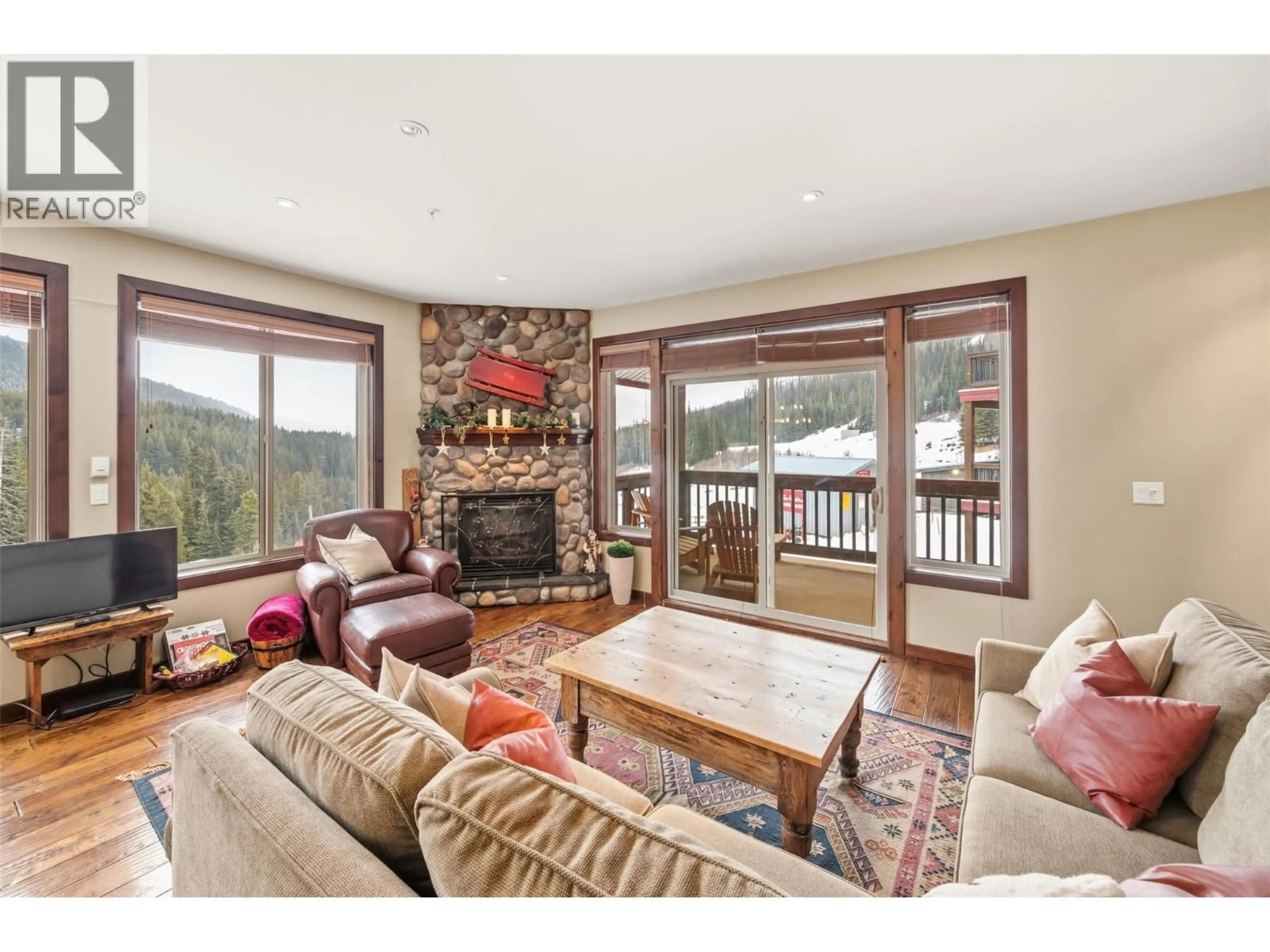 Living room with furniture, wood/laminate floor for 31 - 360 STRAYHORSE ROAD, Apex Mountain British Columbia V2A0E2