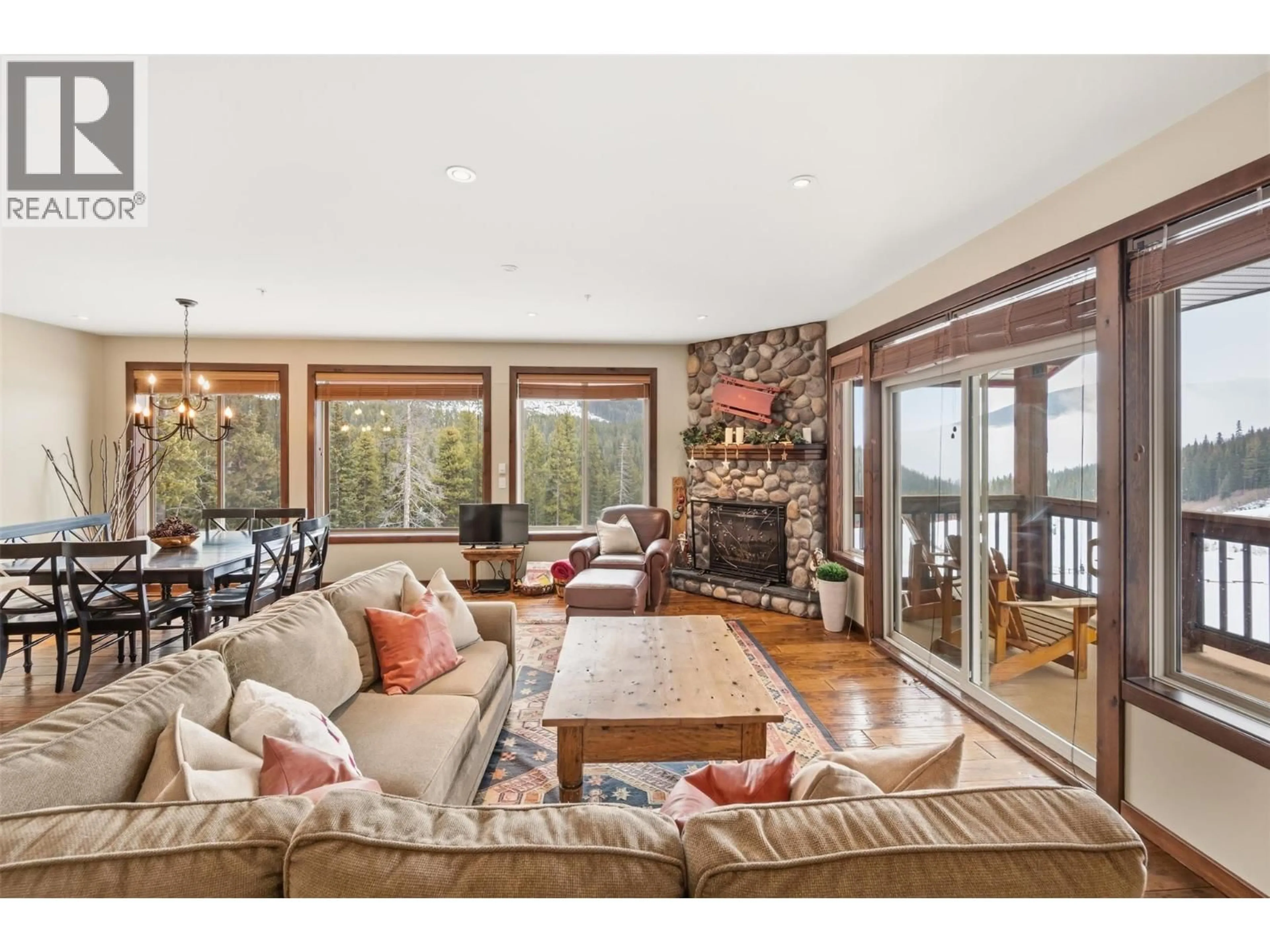 Living room with furniture, wood/laminate floor for 31 - 360 STRAYHORSE ROAD, Apex Mountain British Columbia V2A0E2