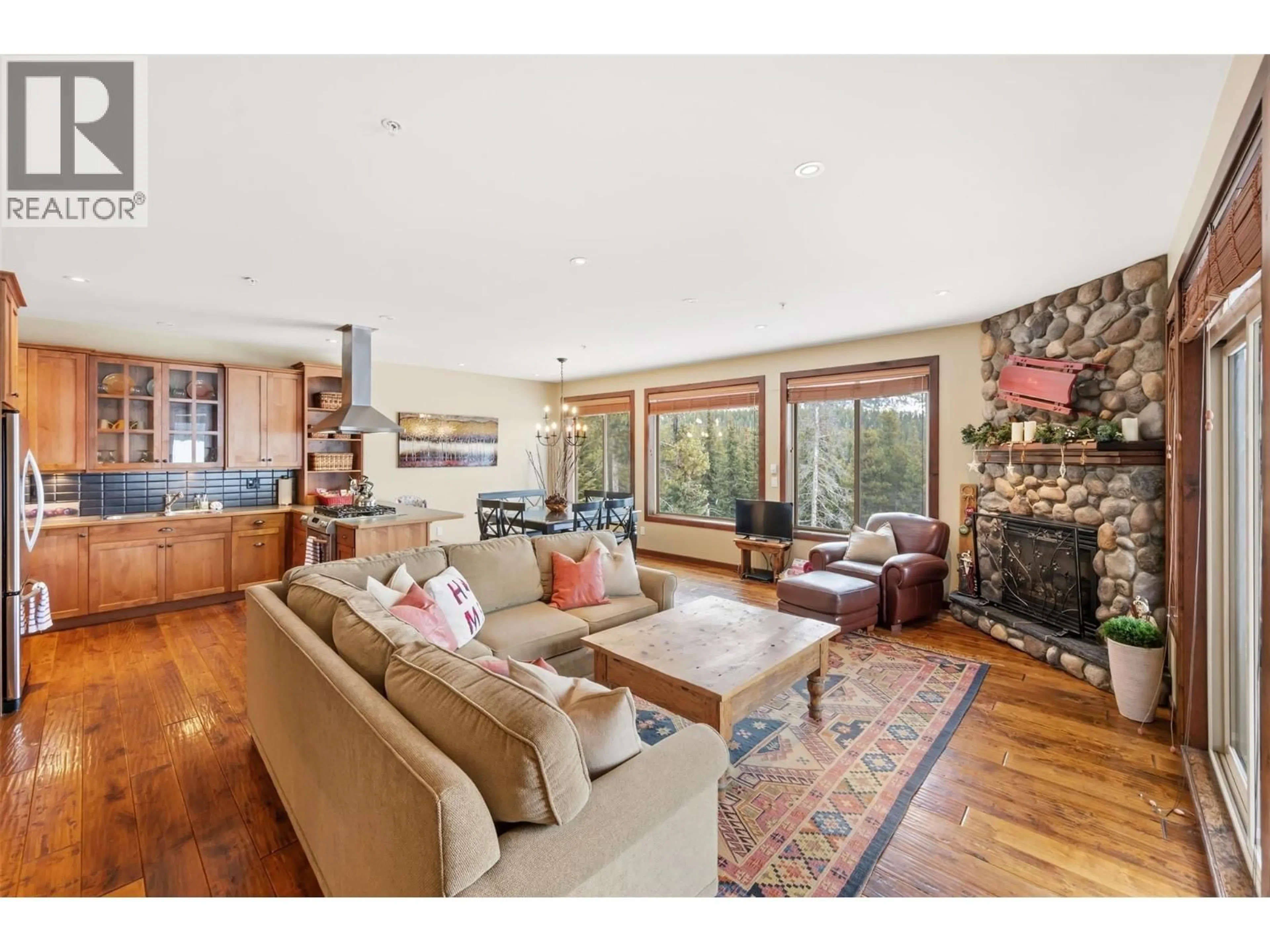 Living room with furniture, wood/laminate floor for 31 - 360 STRAYHORSE ROAD, Apex Mountain British Columbia V2A0E2