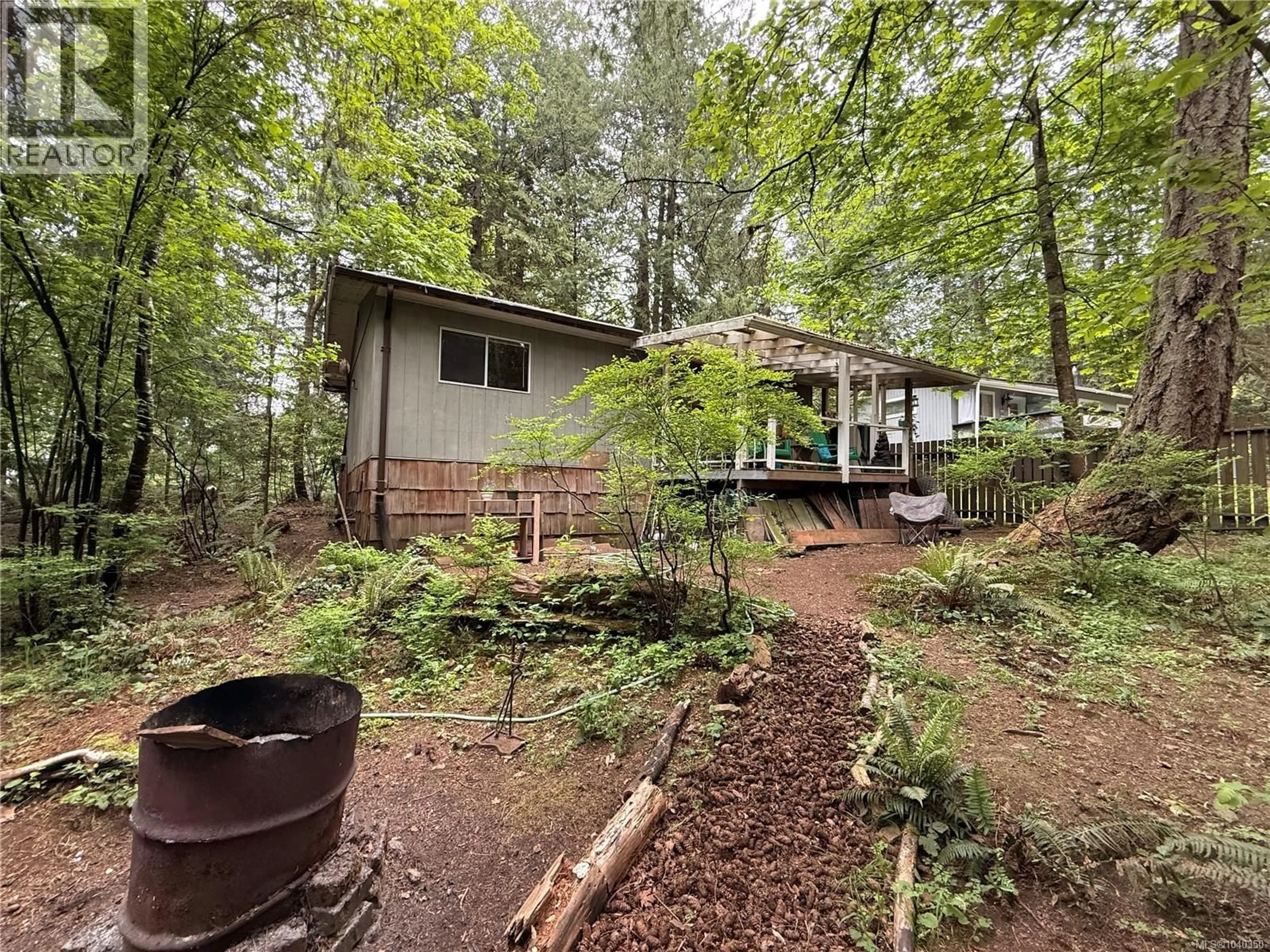 A pic from outside/outdoor area/front of a property/back of a property/a pic from drone, forest/trees view for 19 CAPTAIN MORGANS BOULEVARD, Protection Island British Columbia V9R6R1