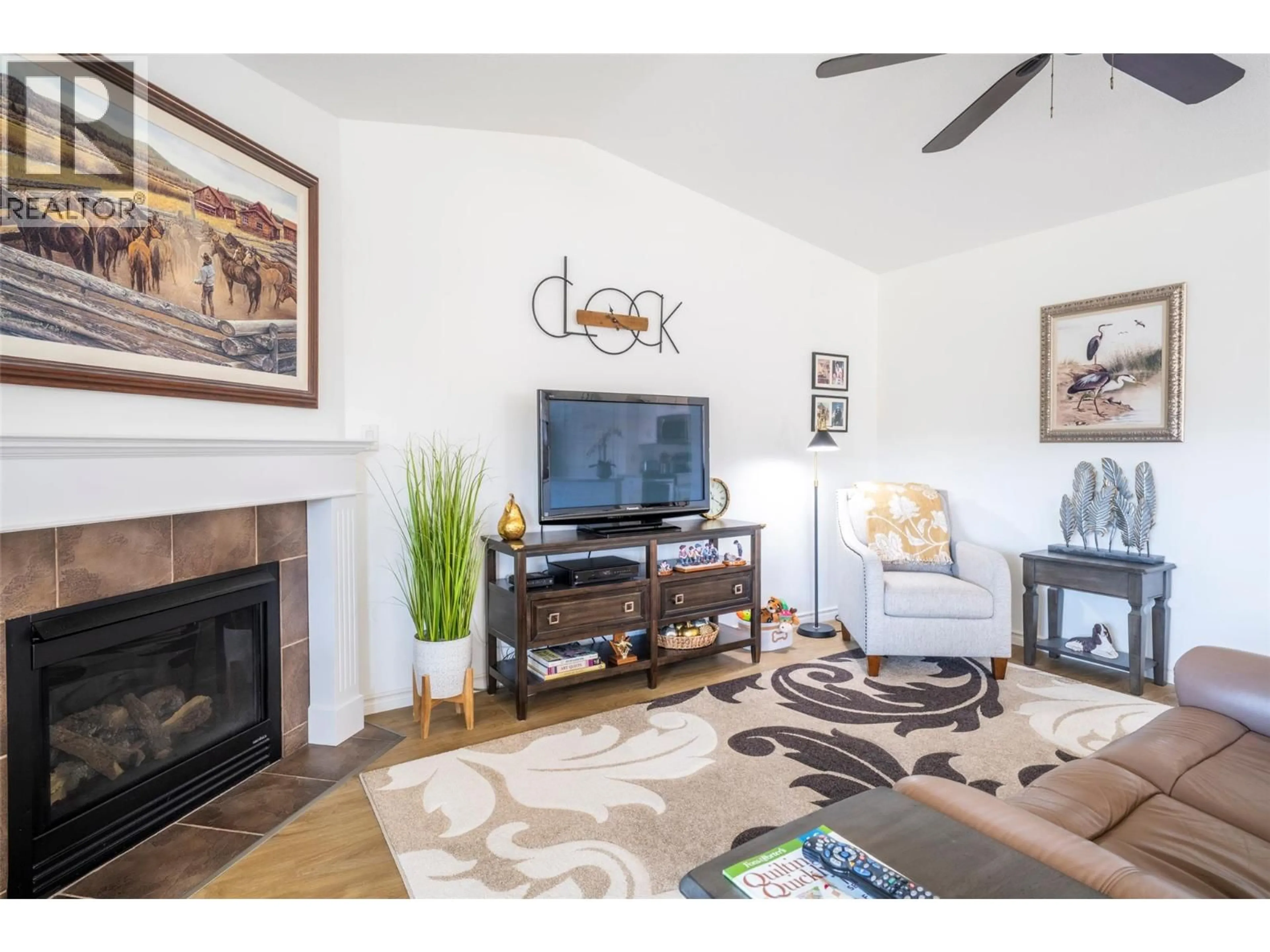 Living room with furniture, wood/laminate floor for 5021 5 AVENUE, Vernon British Columbia V1H2A3