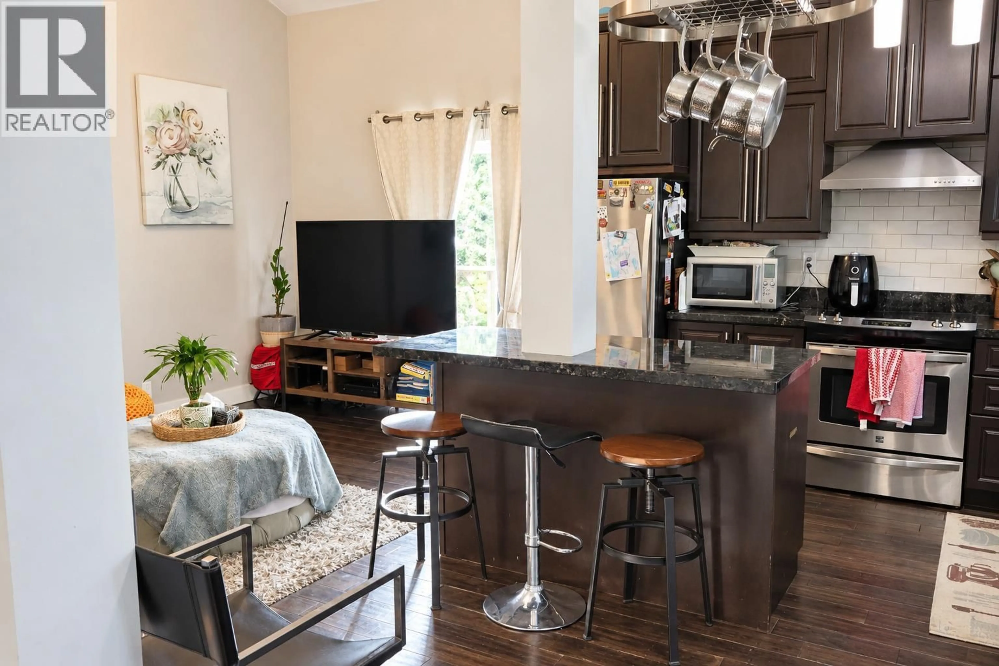 Open concept kitchen, wood/laminate floor for 117 - 1855 LECKIE ROAD, Kelowna British Columbia V1X7H8