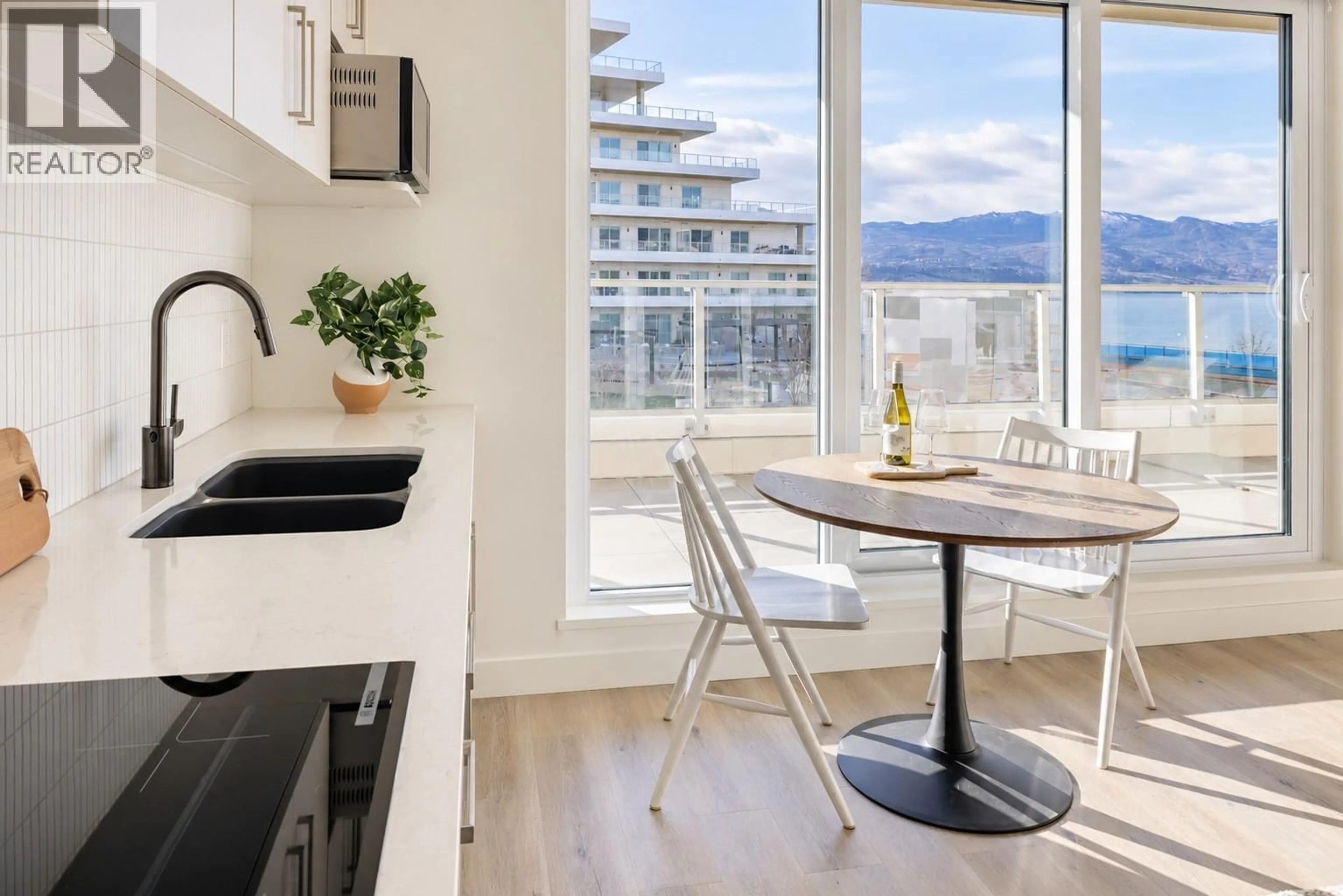 Open concept kitchen, wood/laminate floor for 615 - 3300 LAKESHORE ROAD, Kelowna British Columbia V1W0J9