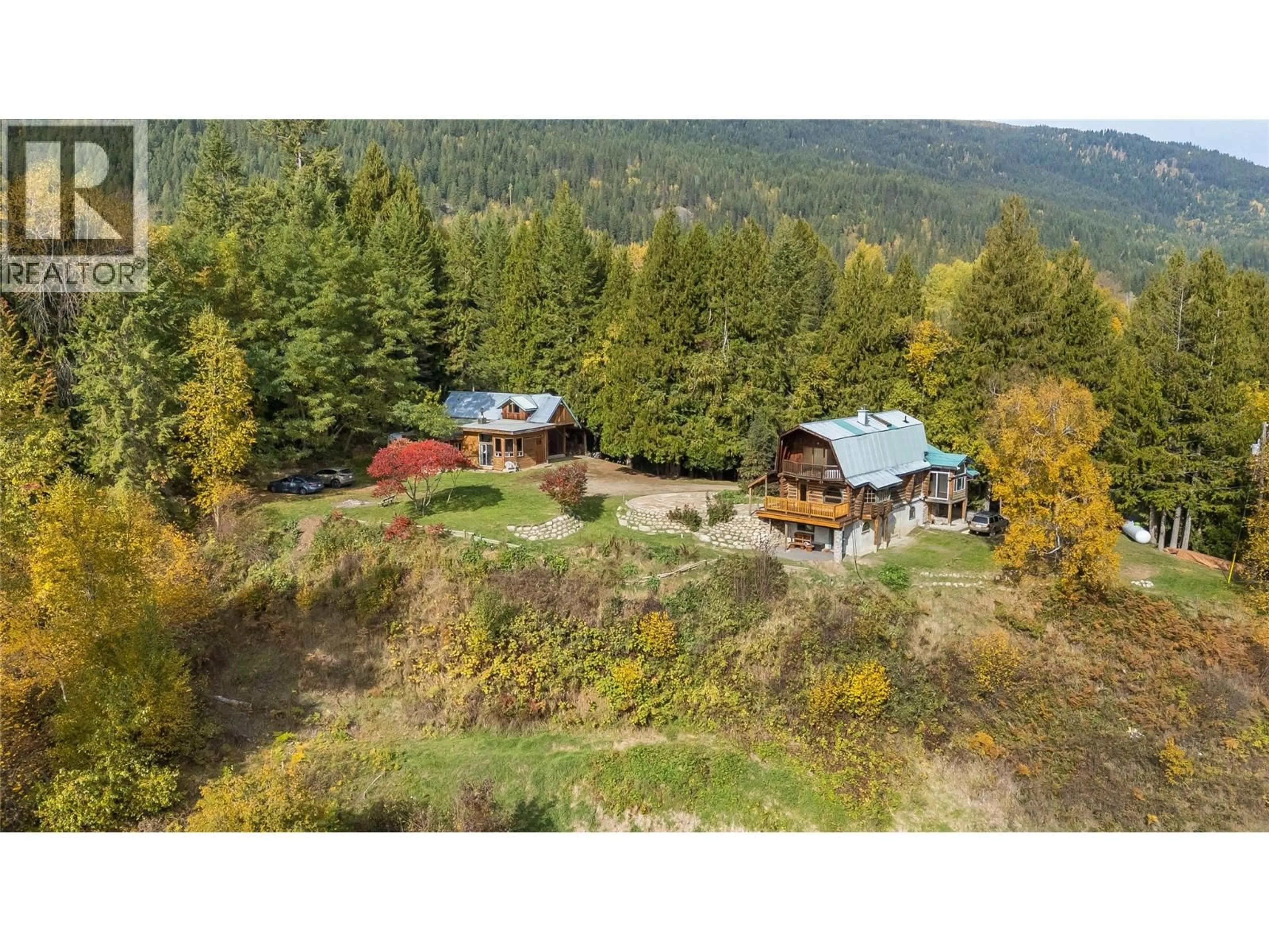 A pic from outside/outdoor area/front of a property/back of a property/a pic from drone, forest/trees view for 6238 YOUNGS ROAD, Winlaw British Columbia V0G2J0