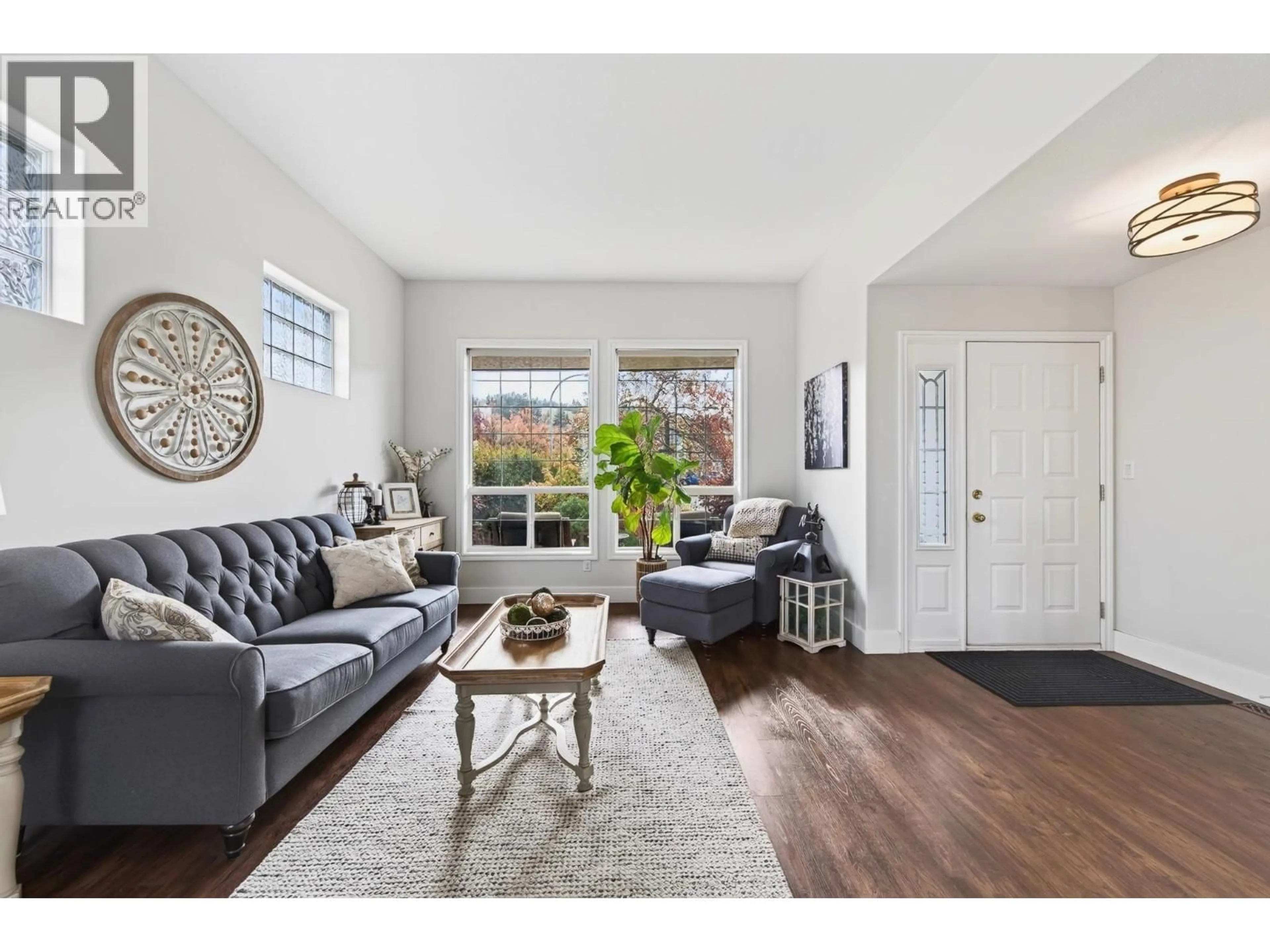 Living room with furniture, wood/laminate floor for 845 BRAMBLE PLACE, Kamloops British Columbia V1S1Y6