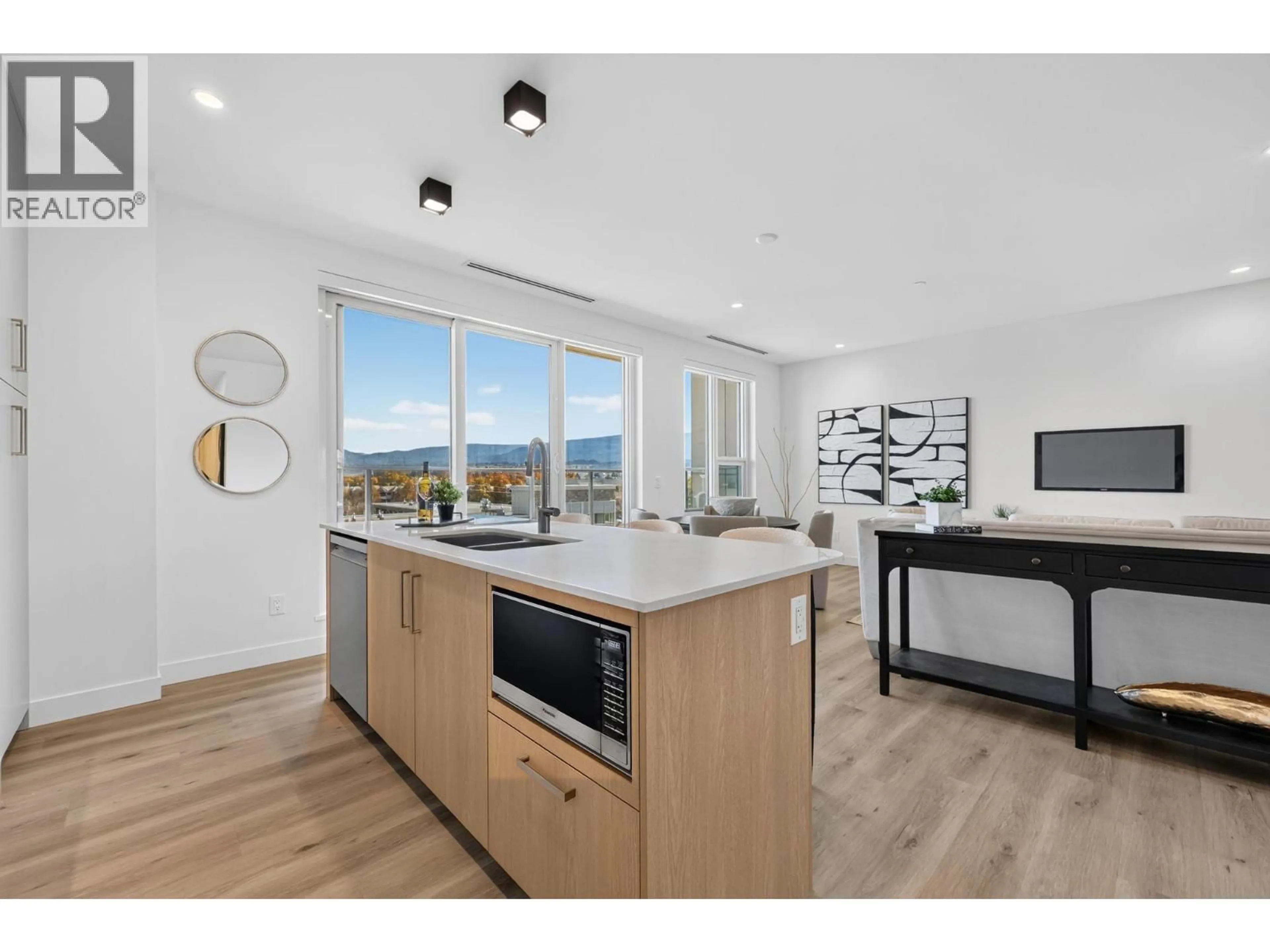 Open concept kitchen, wood/laminate floor for 401 - 3300 LAKESHORE ROAD, Kelowna British Columbia V1W0J9