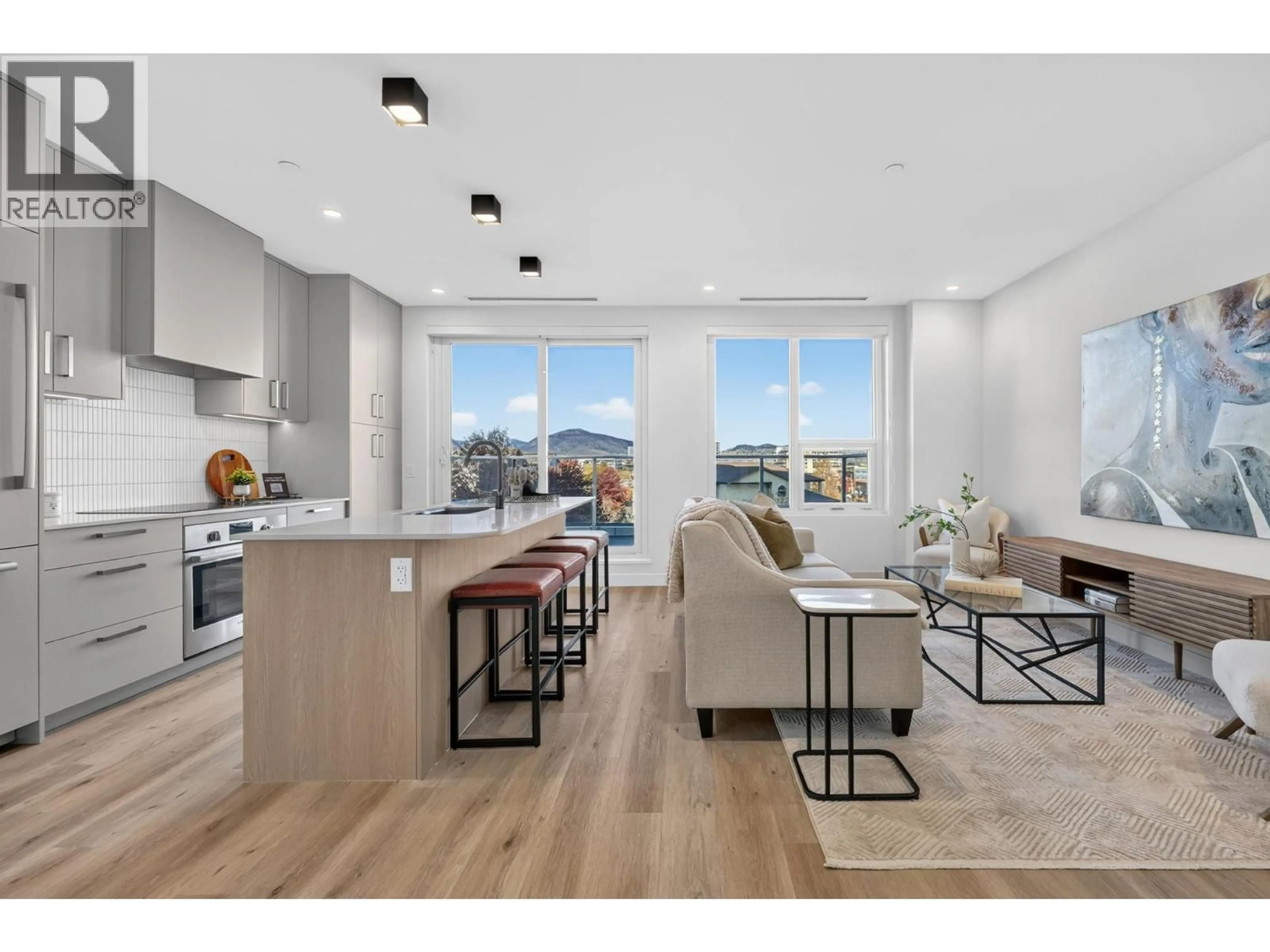 Open concept kitchen, wood/laminate floor for 406 - 3300 LAKESHORE ROAD, Kelowna British Columbia V1W0J9