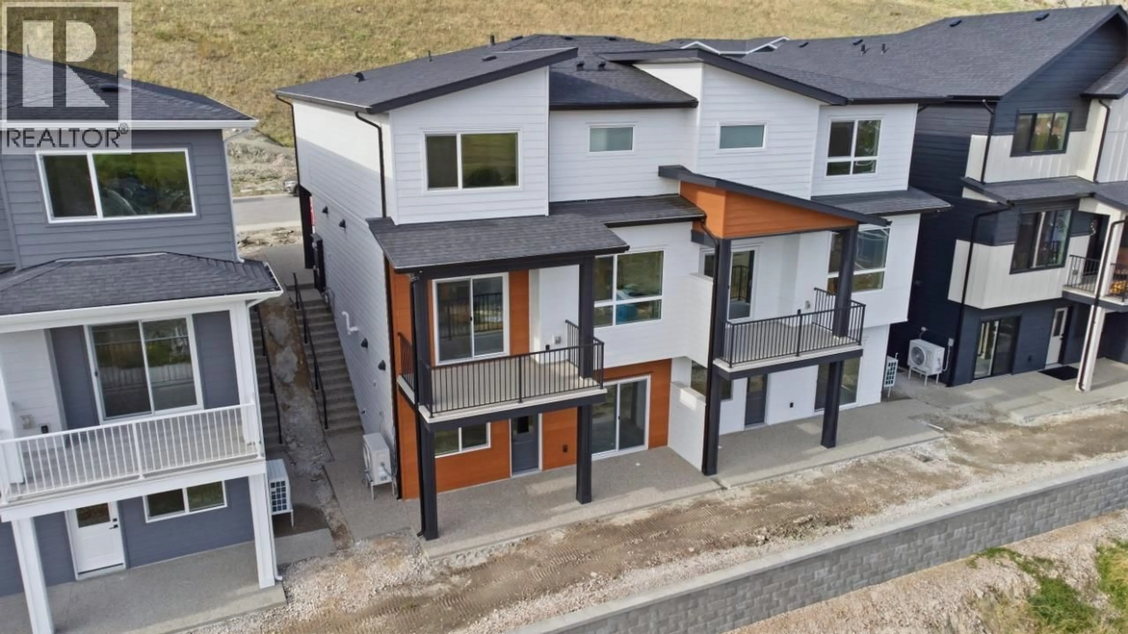 A pic from outside/outdoor area/front of a property/back of a property/a pic from drone, street for 419 ARROWLEAF DRIVE, Coldstream British Columbia V1B0B5
