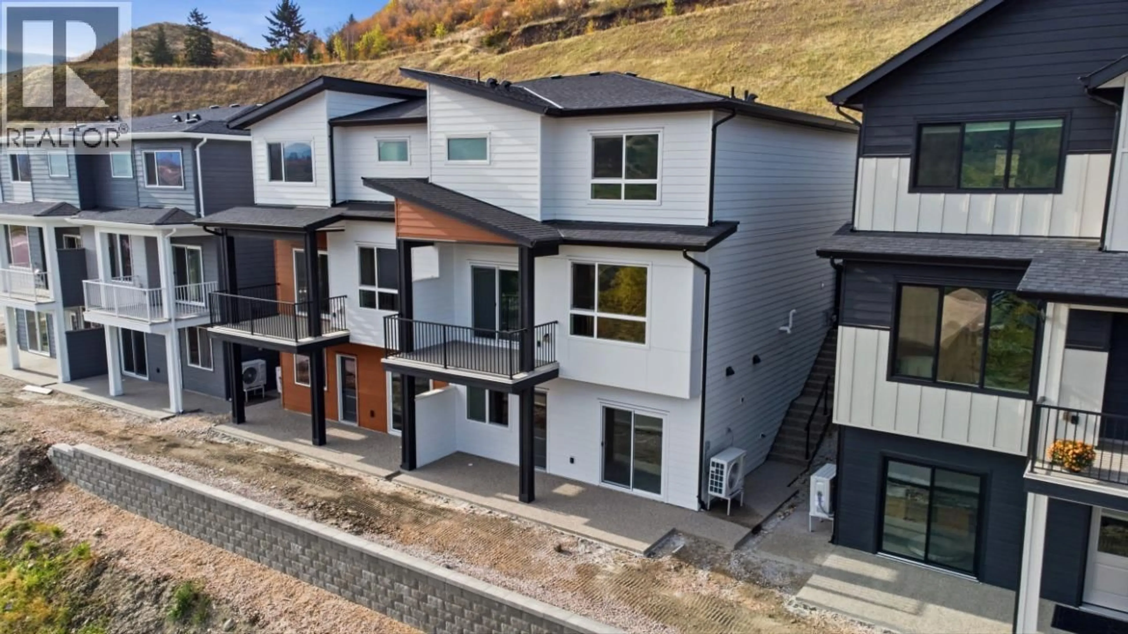 A pic from outside/outdoor area/front of a property/back of a property/a pic from drone, street for 415 ARROWLEAF DRIVE, Coldstream British Columbia V1B0B5