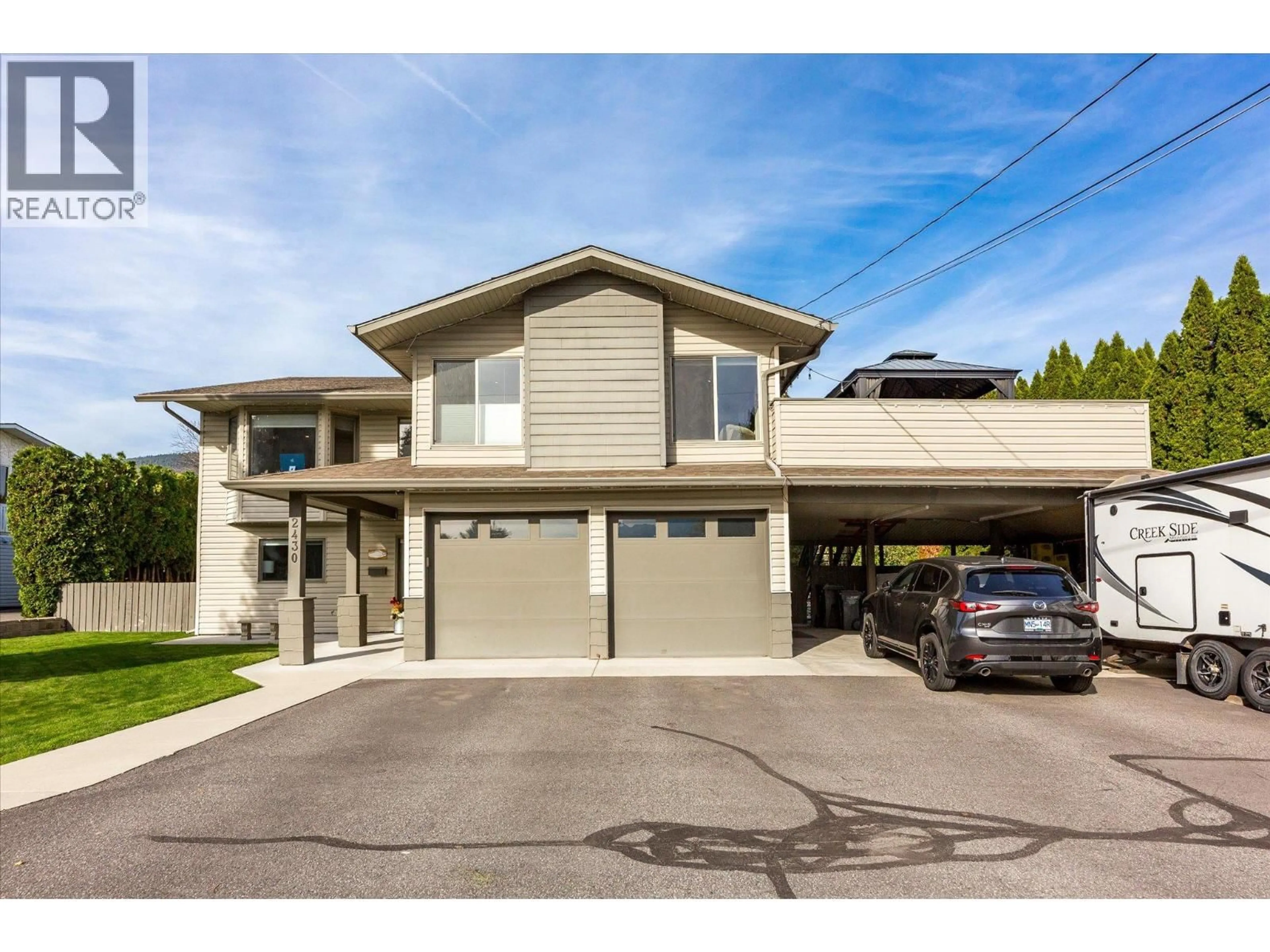 Home with vinyl exterior material, street for 2430 CHIEFTAIN ROAD, West Kelowna British Columbia V4T1N3