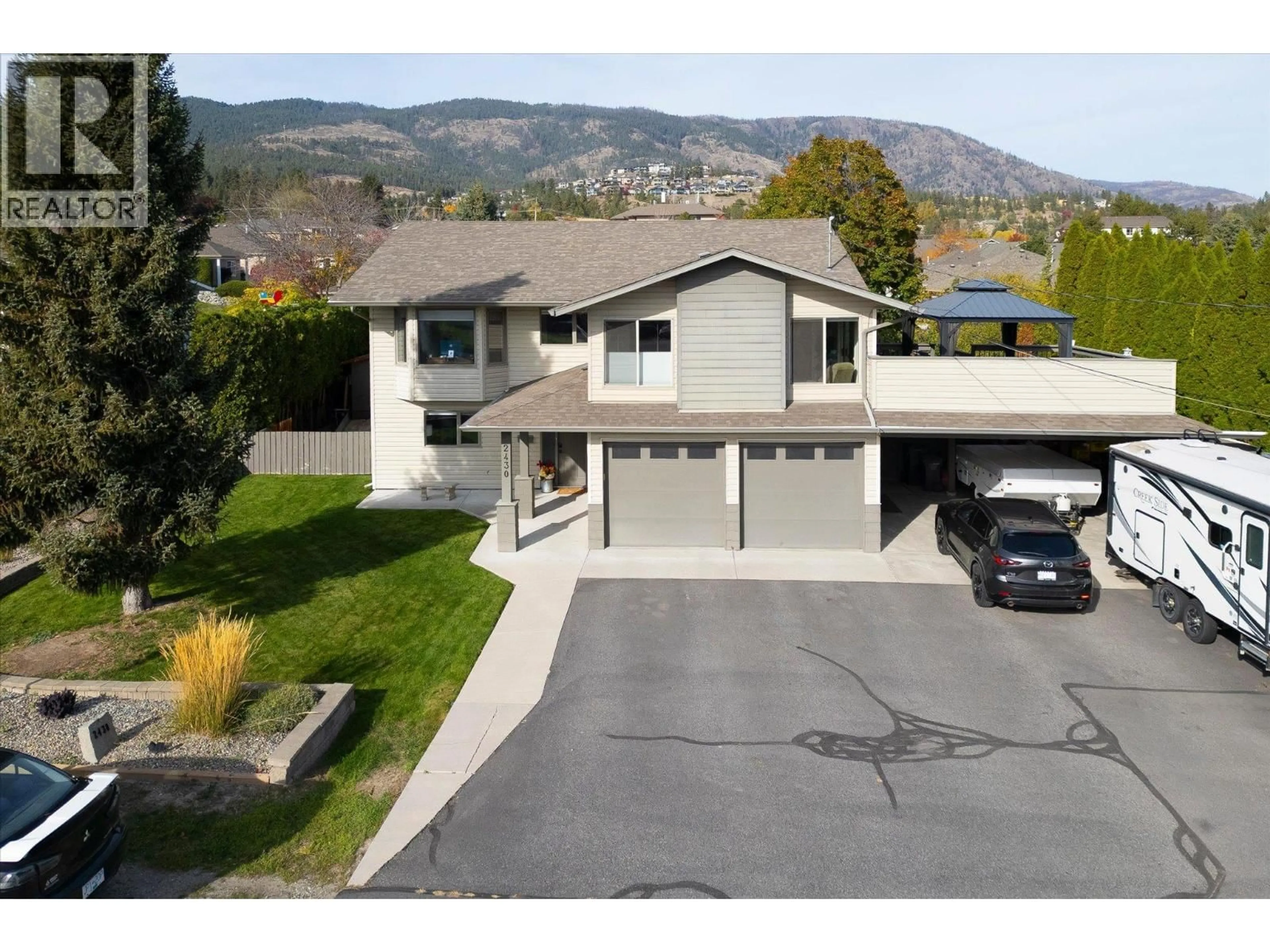 A pic from outside/outdoor area/front of a property/back of a property/a pic from drone, mountain view for 2430 CHIEFTAIN ROAD, West Kelowna British Columbia V4T1N3