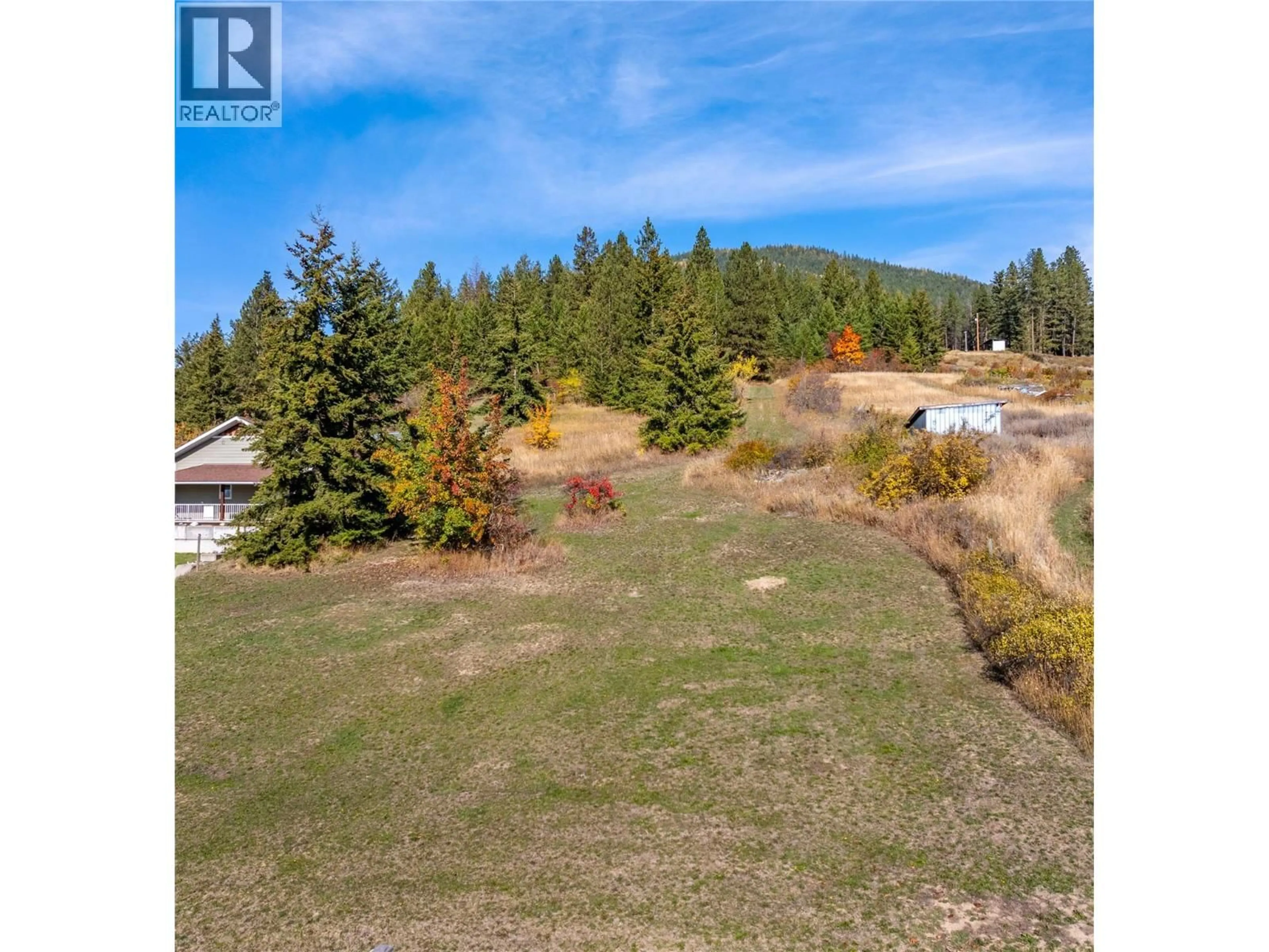 A pic from outside/outdoor area/front of a property/back of a property/a pic from drone, forest/trees view for 2812 HIGHWAY 3 OTHER, Creston British Columbia V0B1G1