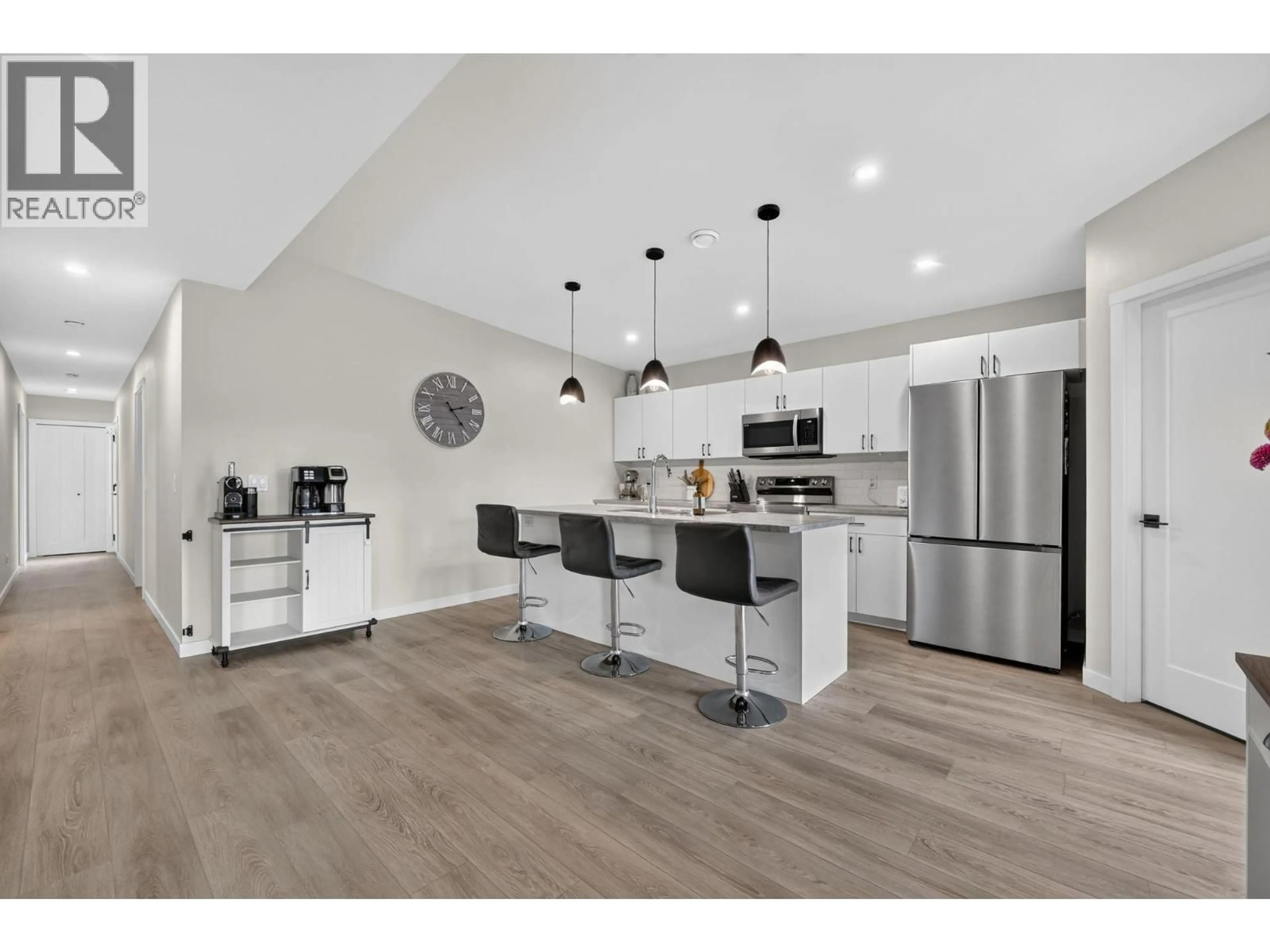 Open concept kitchen, wood/laminate floor for 9 - 8900 JIM BAILEY ROAD, Kelowna British Columbia V4V0B5