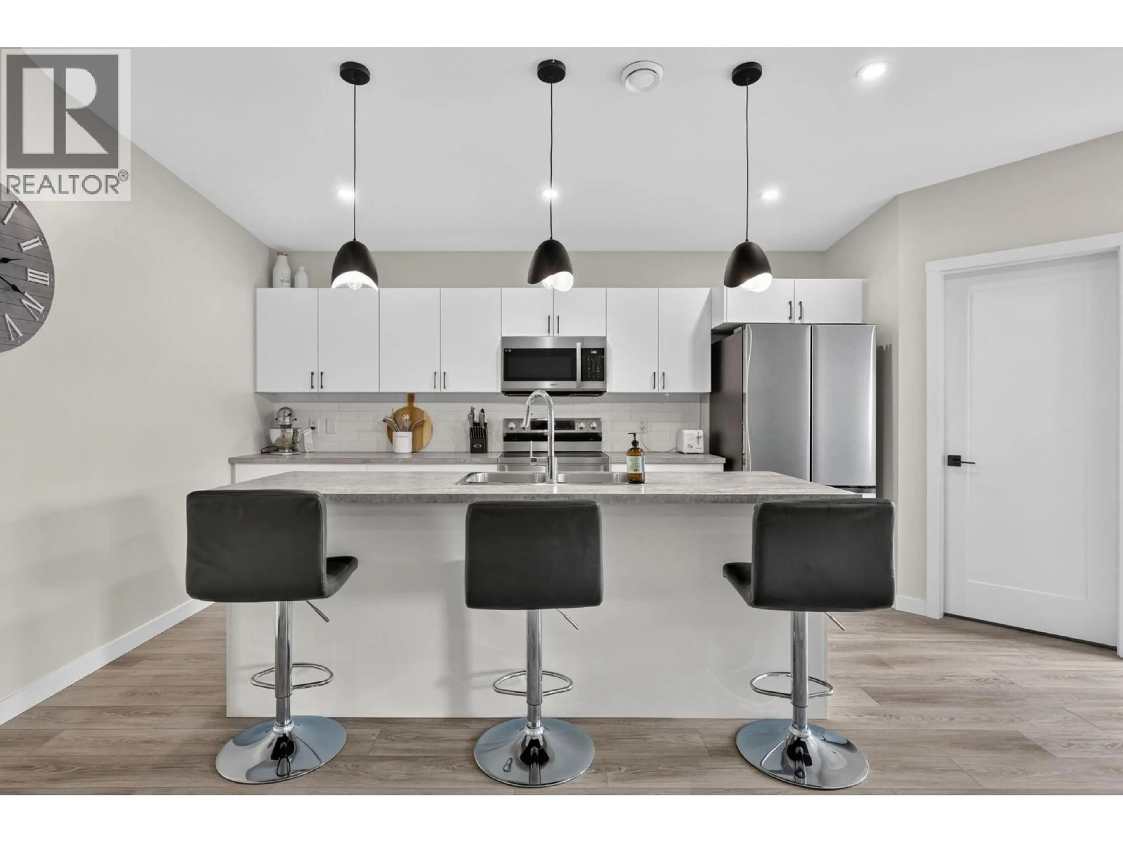 Open concept kitchen, wood/laminate floor for 9 - 8900 JIM BAILEY ROAD, Kelowna British Columbia V4V0B5