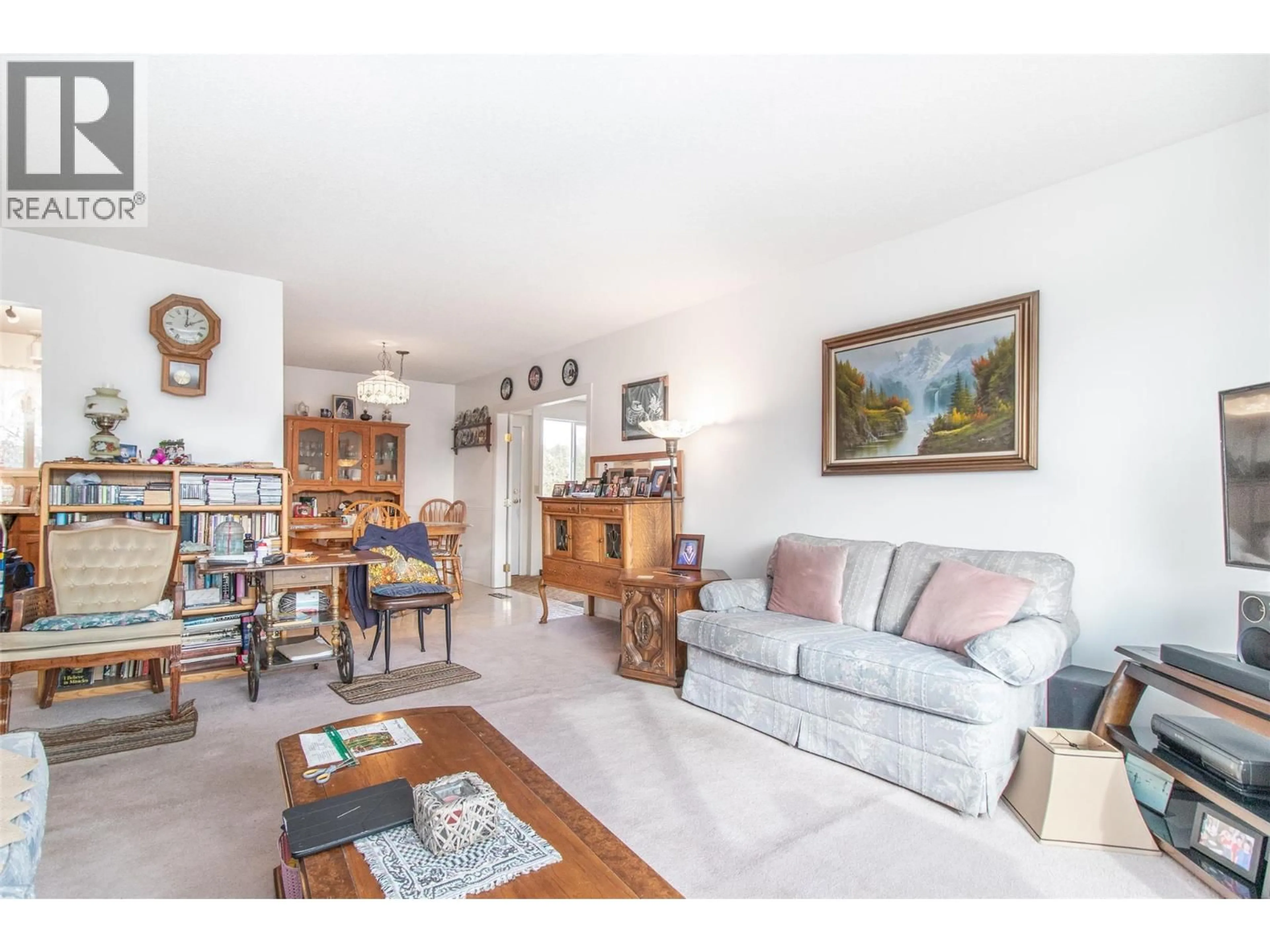 Living room with furniture, wood/laminate floor for 440 HARDIE ROAD, Kelowna British Columbia V1X2H2