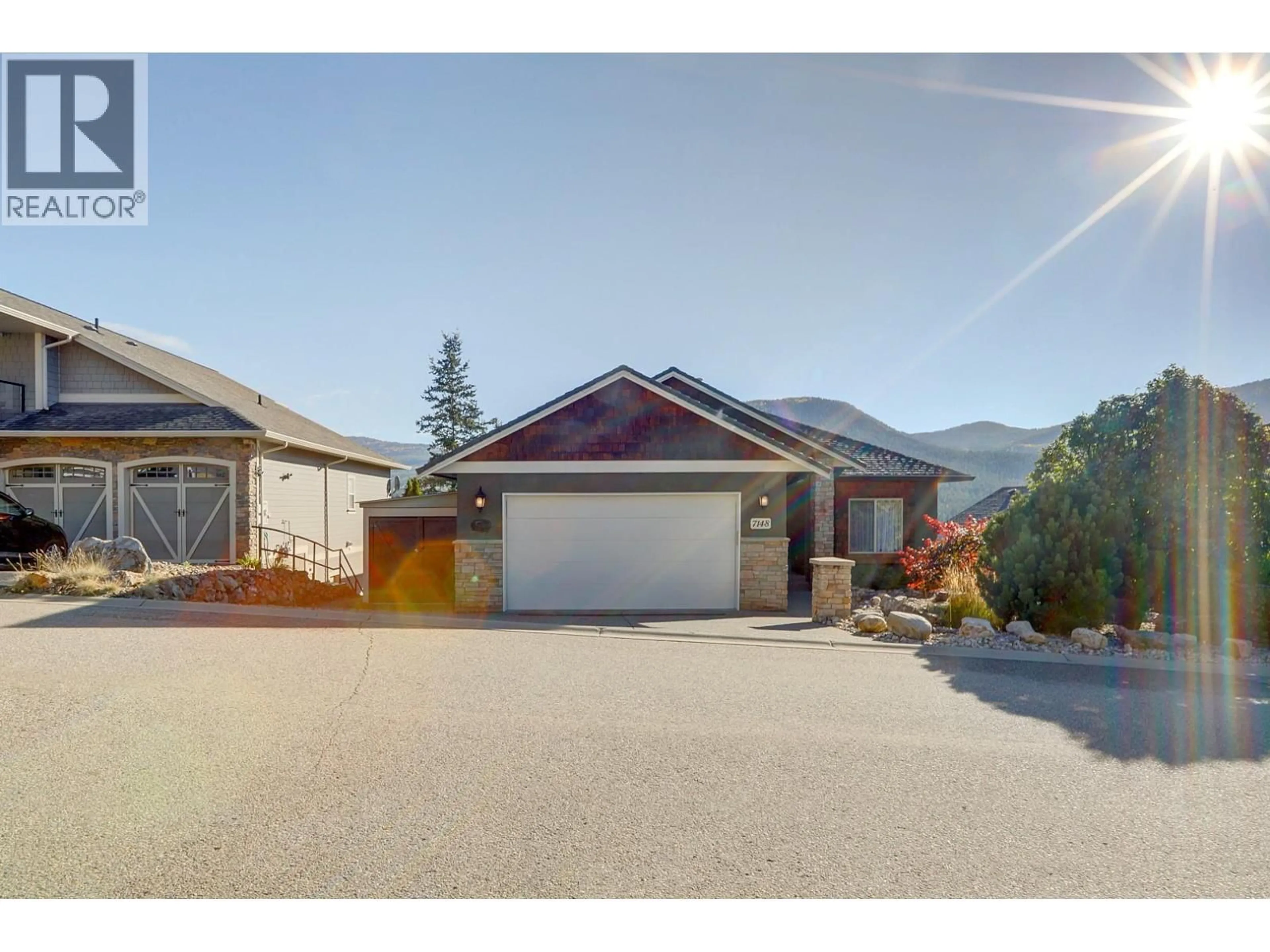 A pic from outside/outdoor area/front of a property/back of a property/a pic from drone, street for 7148 TABOR DRIVE, Vernon British Columbia V1B4A4