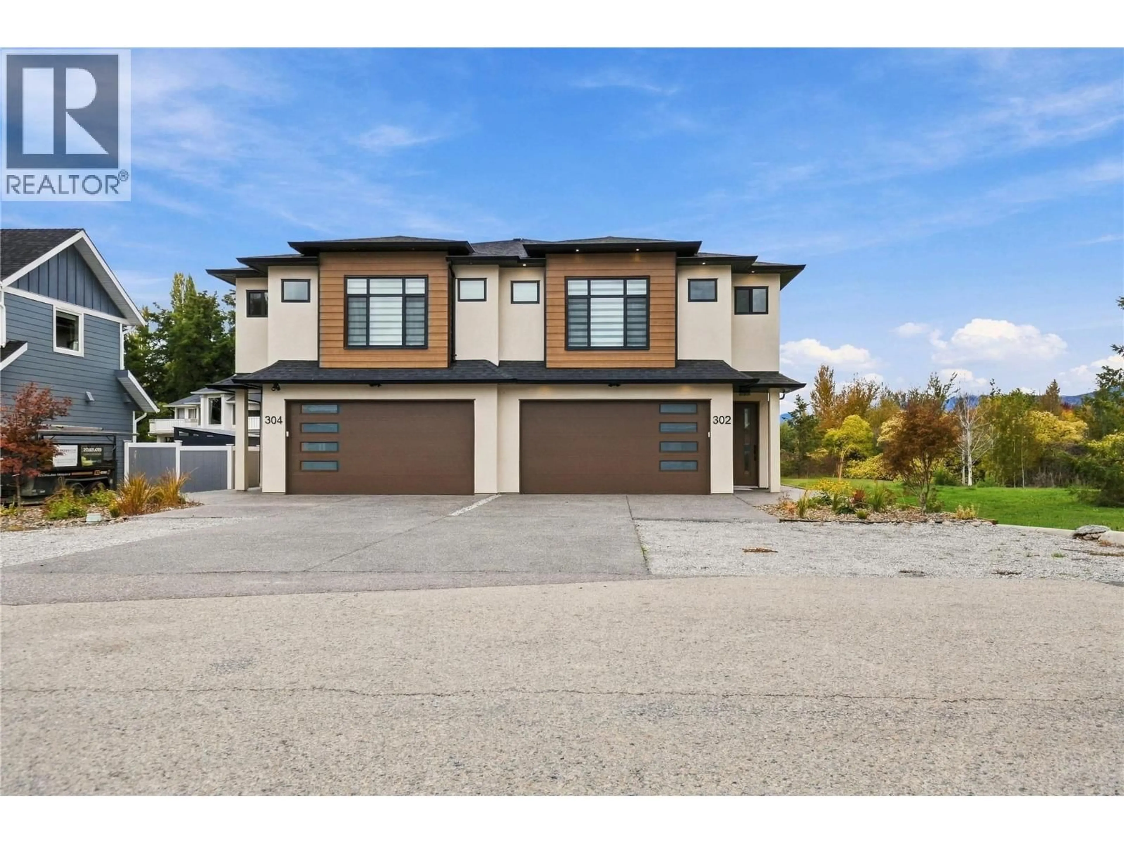 Home with vinyl exterior material, street for 302 SUMAC ROAD WEST, Kelowna British Columbia V1X6W8