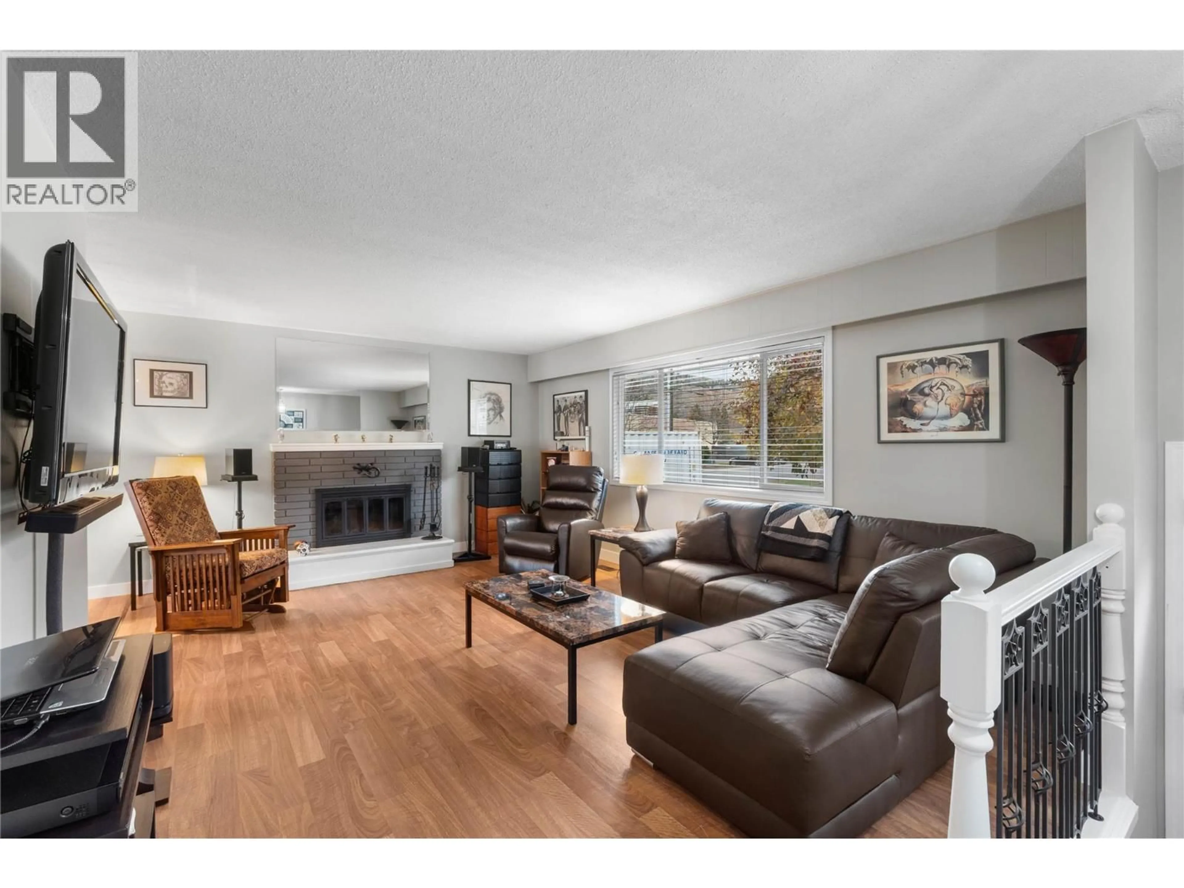 Living room with furniture, wood/laminate floor for 695 STEINKE PLACE, Kamloops British Columbia V2B7L7