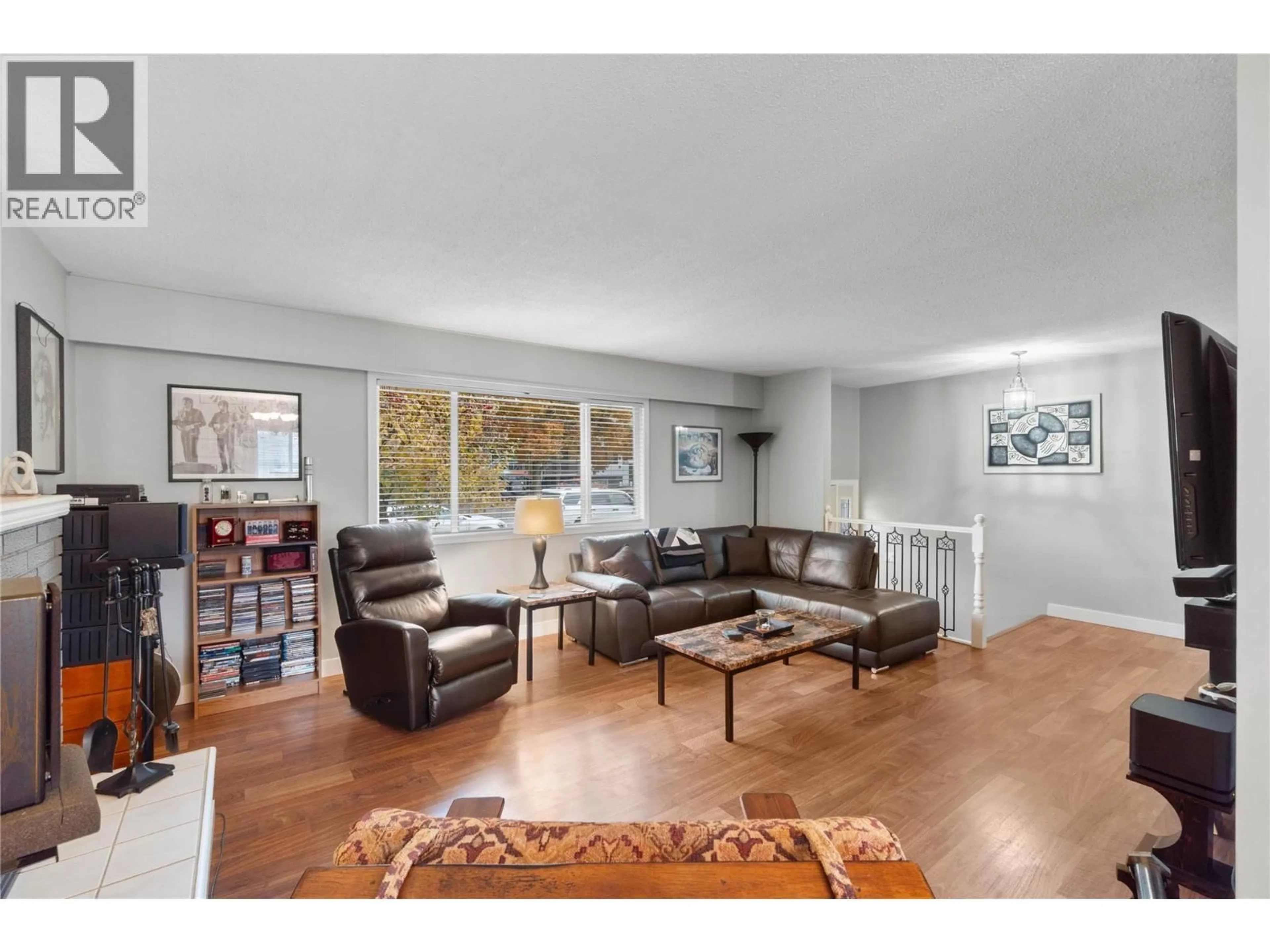 Living room with furniture, wood/laminate floor for 695 STEINKE PLACE, Kamloops British Columbia V2B7L7