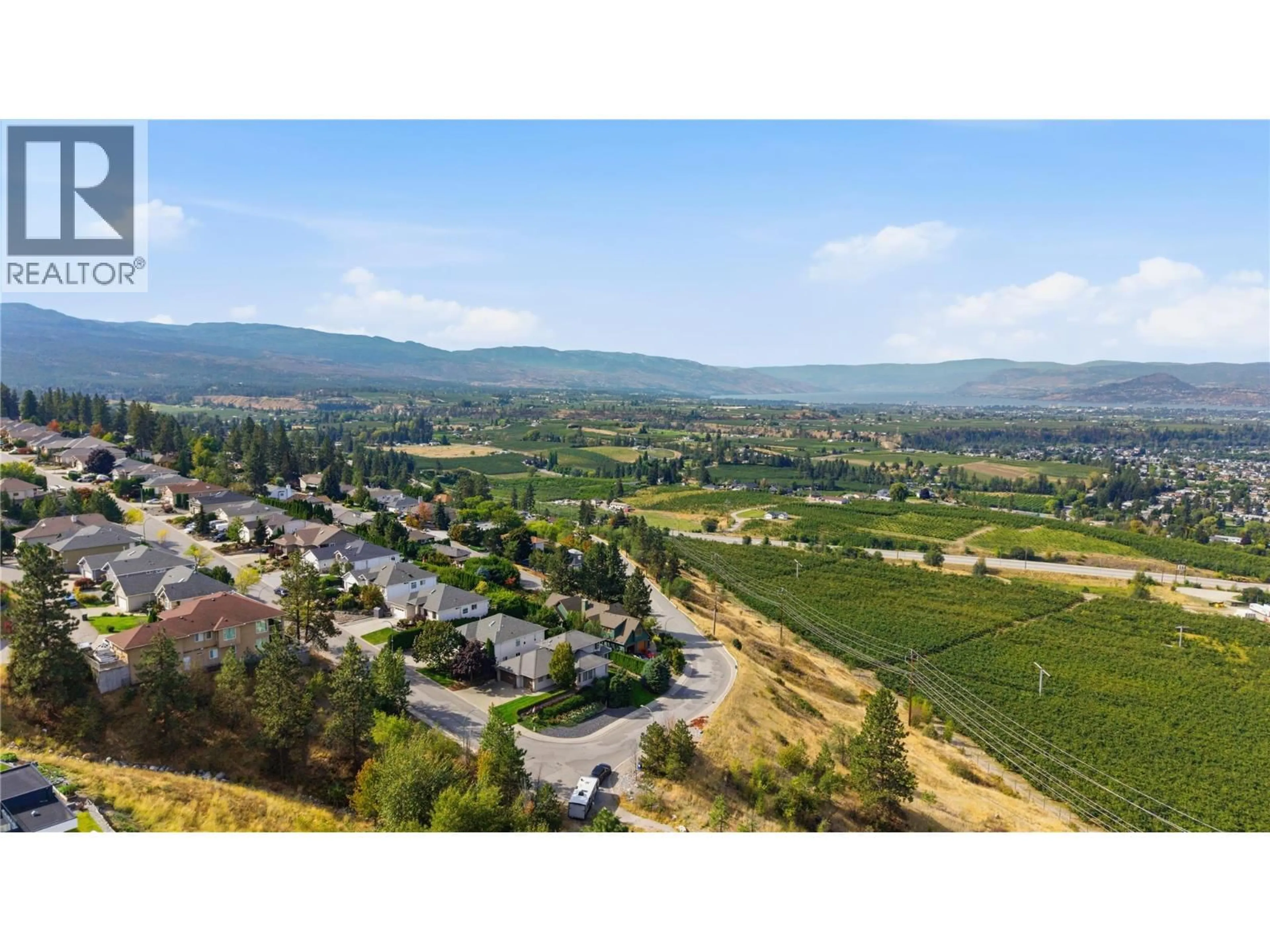 A pic from outside/outdoor area/front of a property/back of a property/a pic from drone, mountain view for 724 LONE PINE DRIVE, Kelowna British Columbia V1P1A1