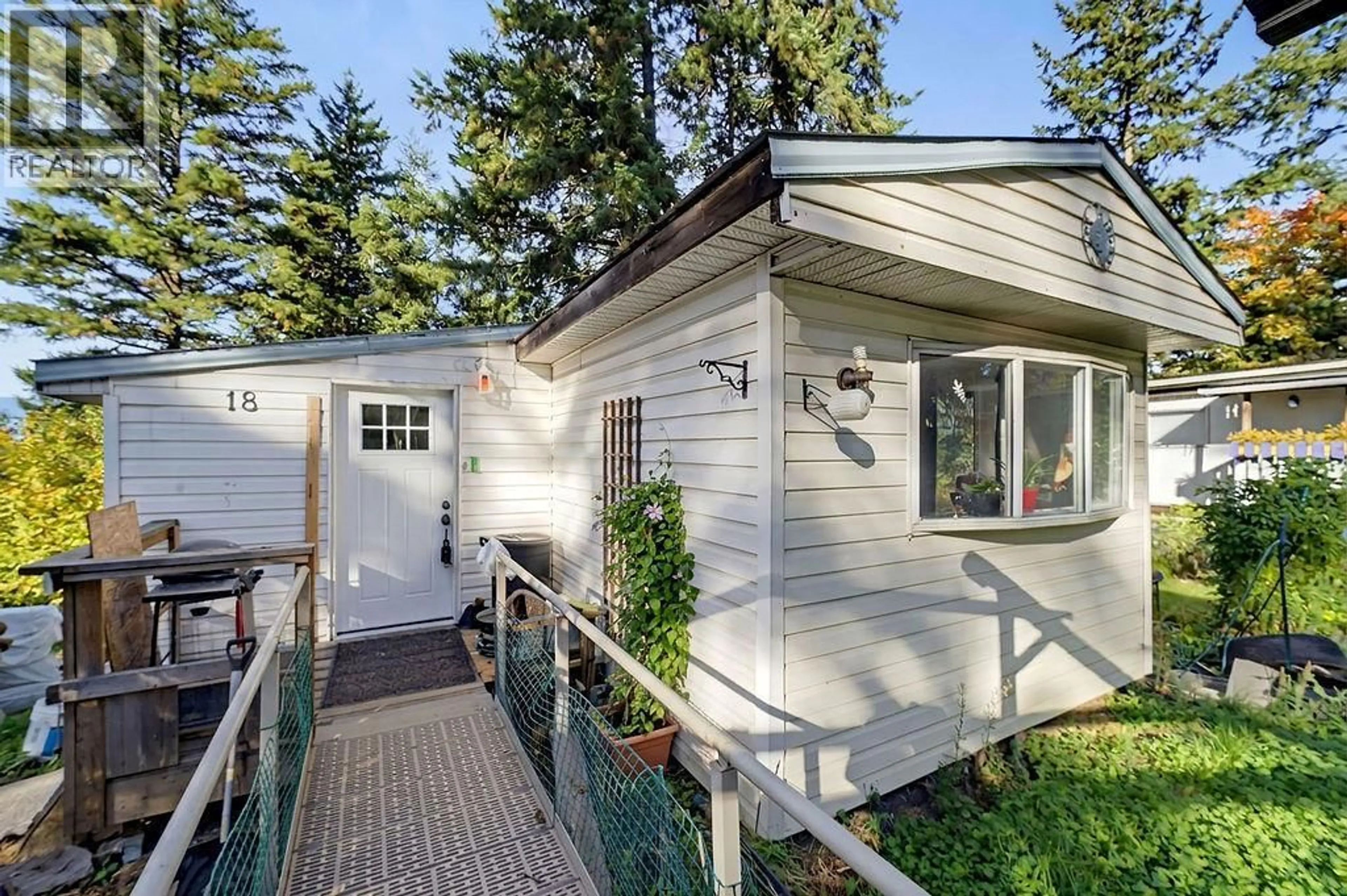 Home with vinyl exterior material, street for 18 - 4137 SPALLUMCHEEN DRIVE, Armstrong British Columbia V0E1B6