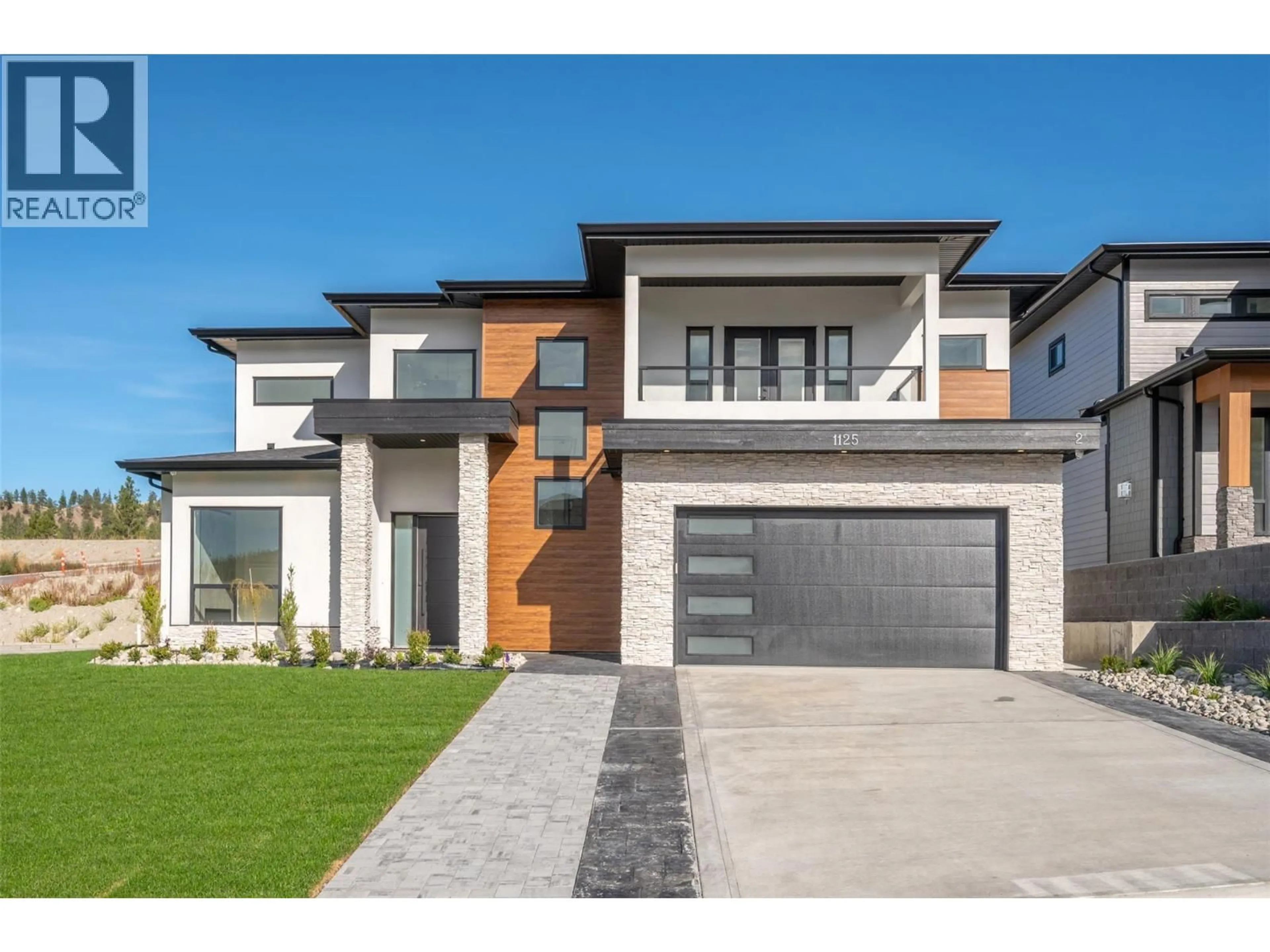 Home with brick exterior material, street for 1125 ANTLER DRIVE, Penticton British Columbia V2A9G6