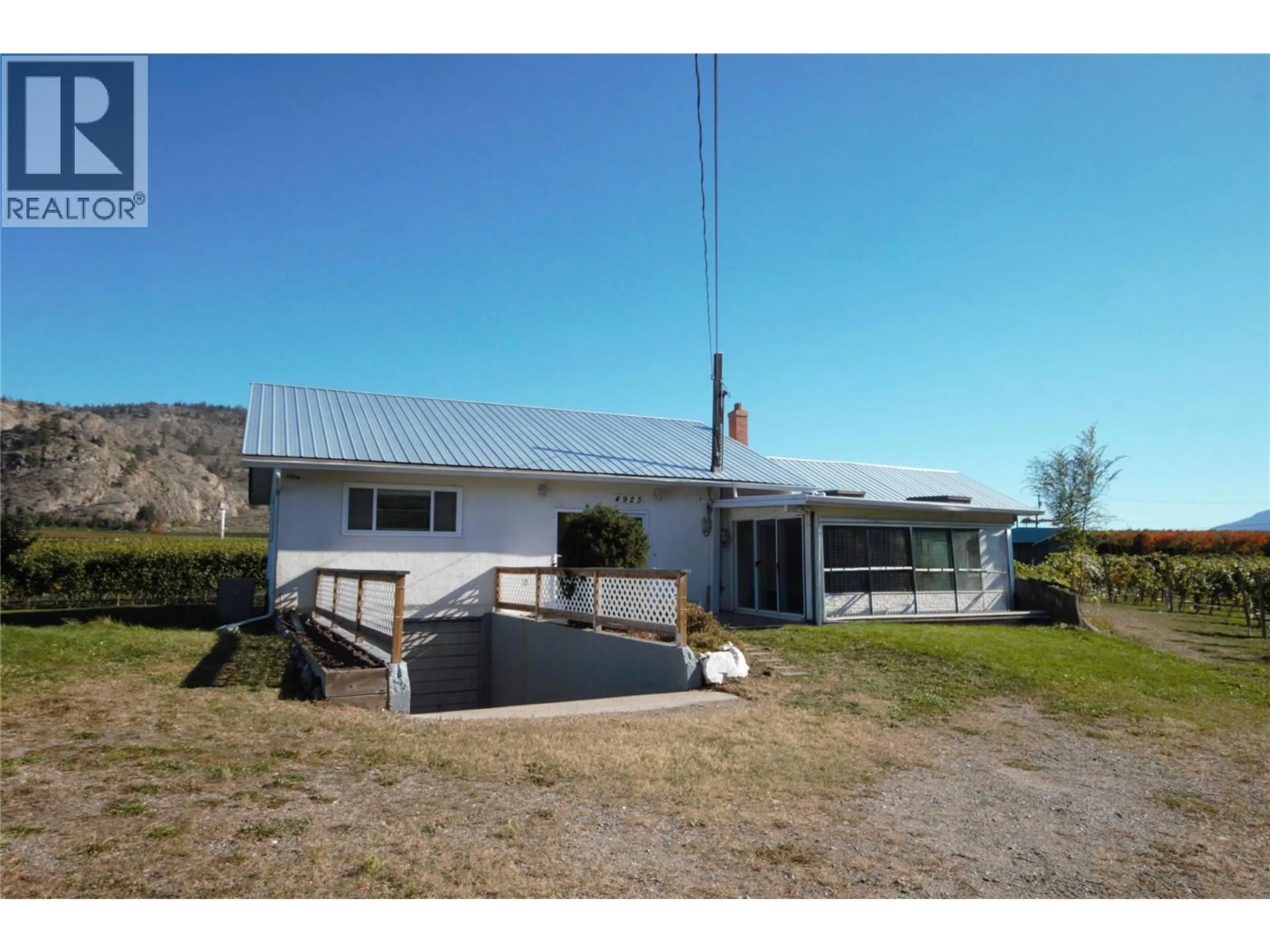 A pic from outside/outdoor area/front of a property/back of a property/a pic from drone, building for 4923 RYEGRASS ROAD, Oliver British Columbia V0H1T1