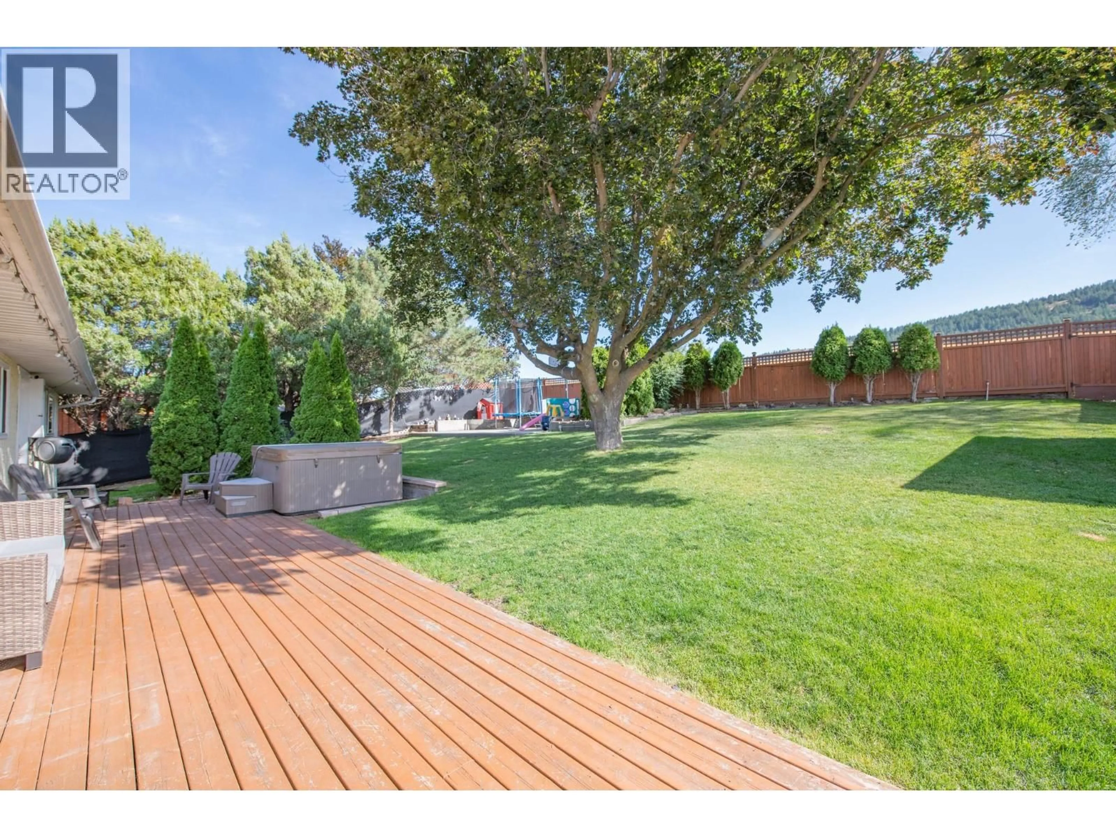 A pic from outside/outdoor area/front of a property/back of a property/a pic from drone, street for 7126 LONGACRE DRIVE, Vernon British Columbia V1H1H6