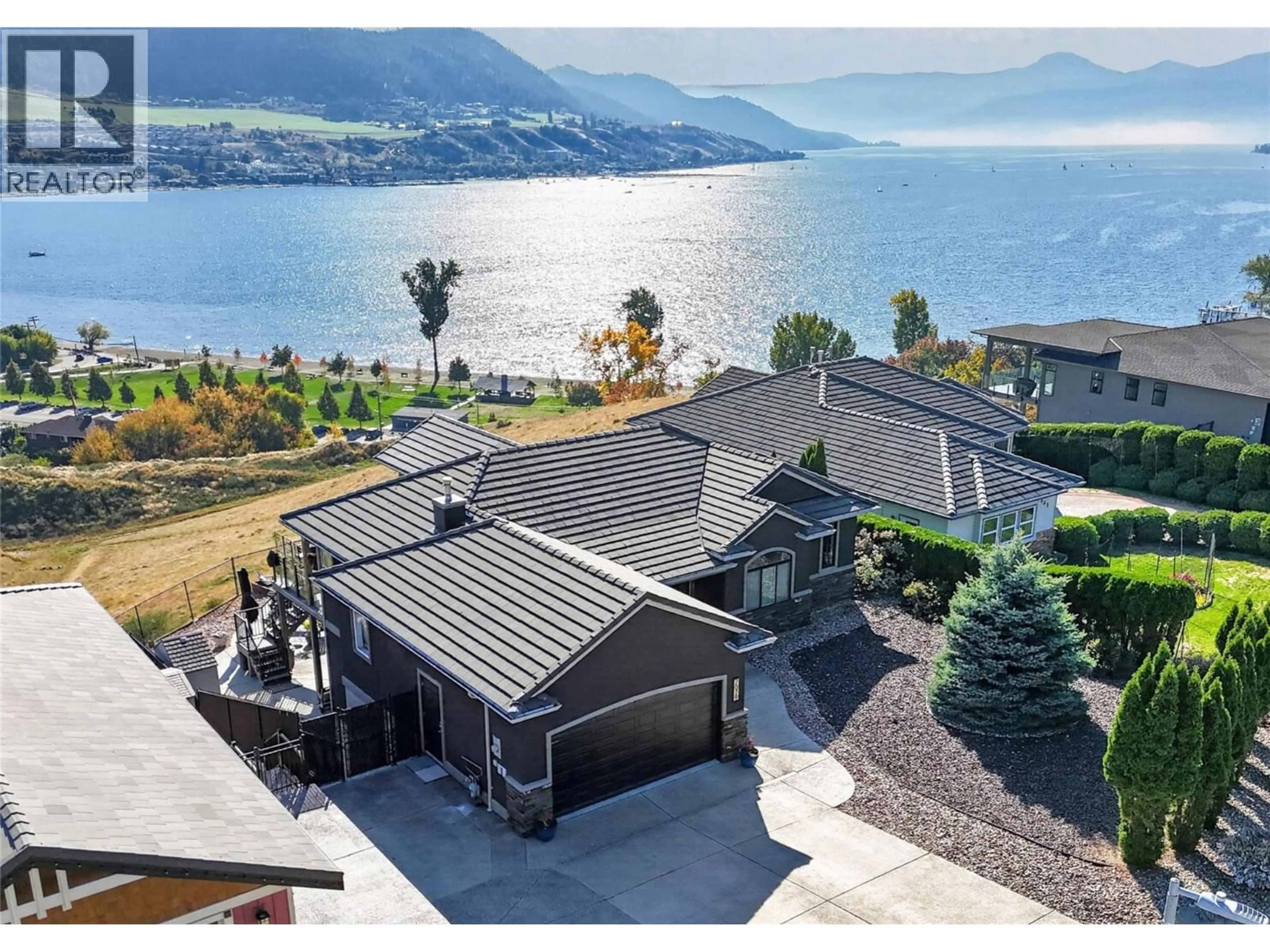 A pic from outside/outdoor area/front of a property/back of a property/a pic from drone, water/lake/river/ocean view for 7079 JASPER DRIVE, Vernon British Columbia V1H1P2