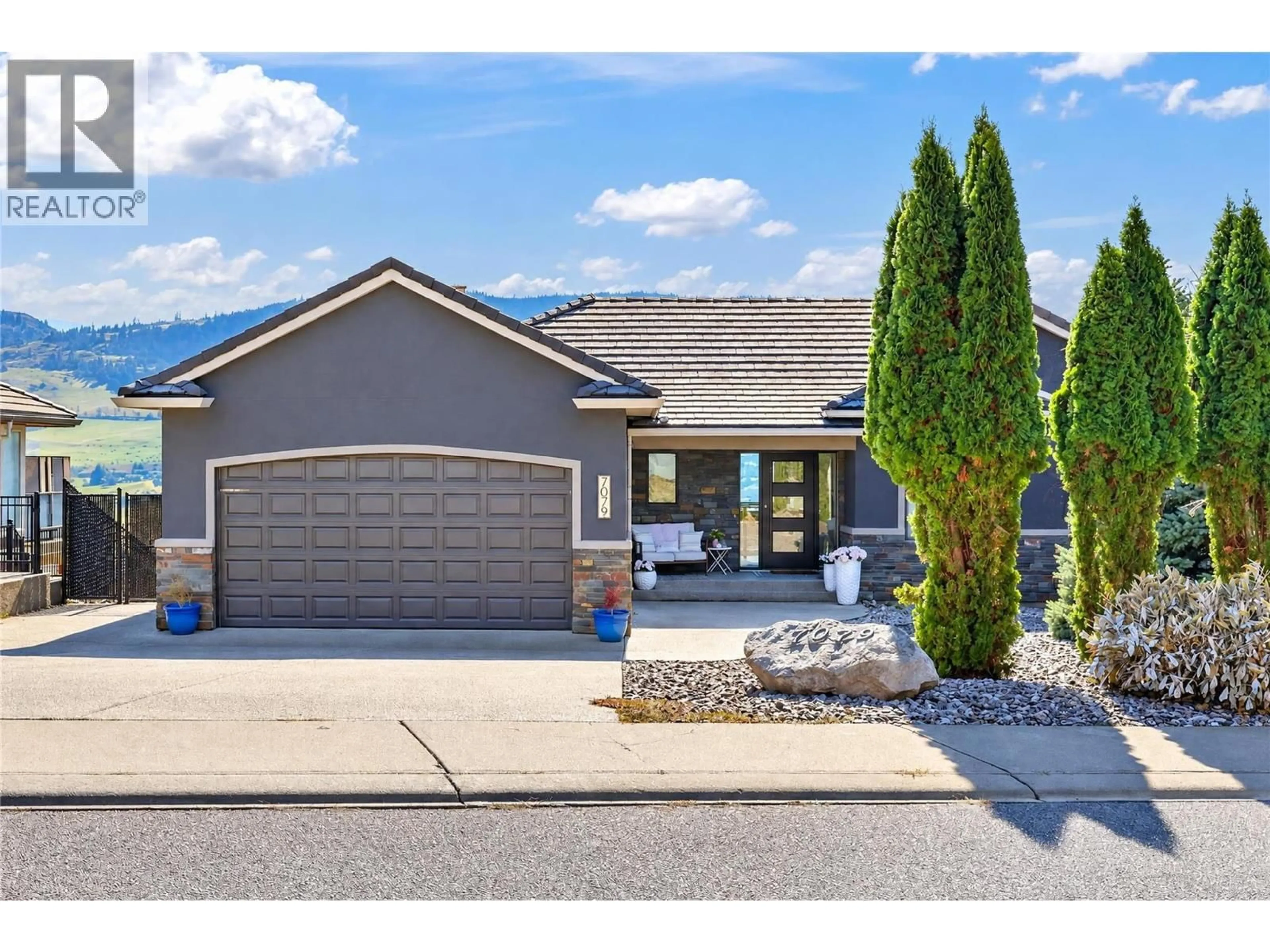 Home with vinyl exterior material, street for 7079 JASPER DRIVE, Vernon British Columbia V1H1P2