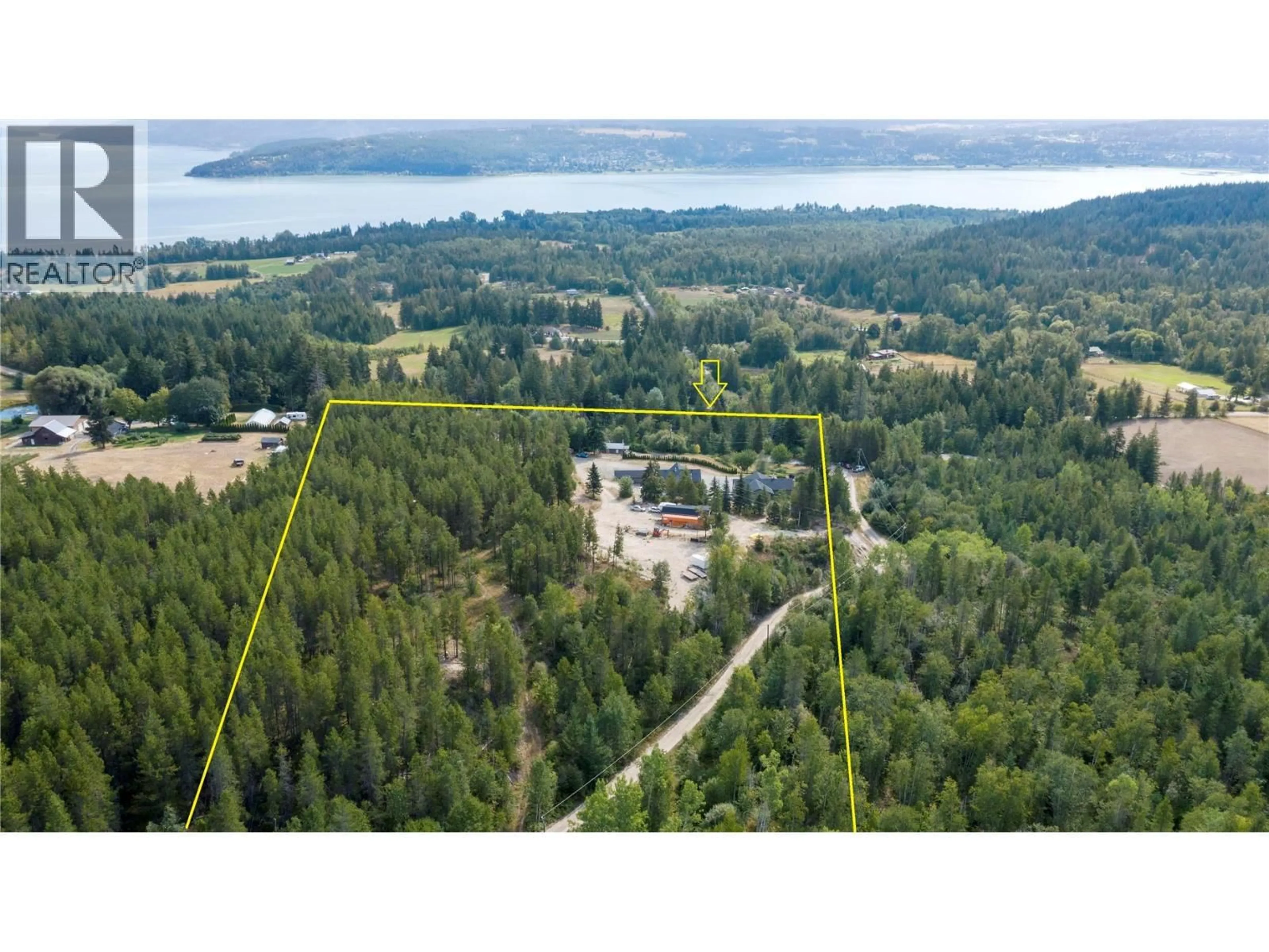 A pic from outside/outdoor area/front of a property/back of a property/a pic from drone, forest/trees view for 5121 50 STREET NORTHWEST, Salmon Arm British Columbia V1E3A6