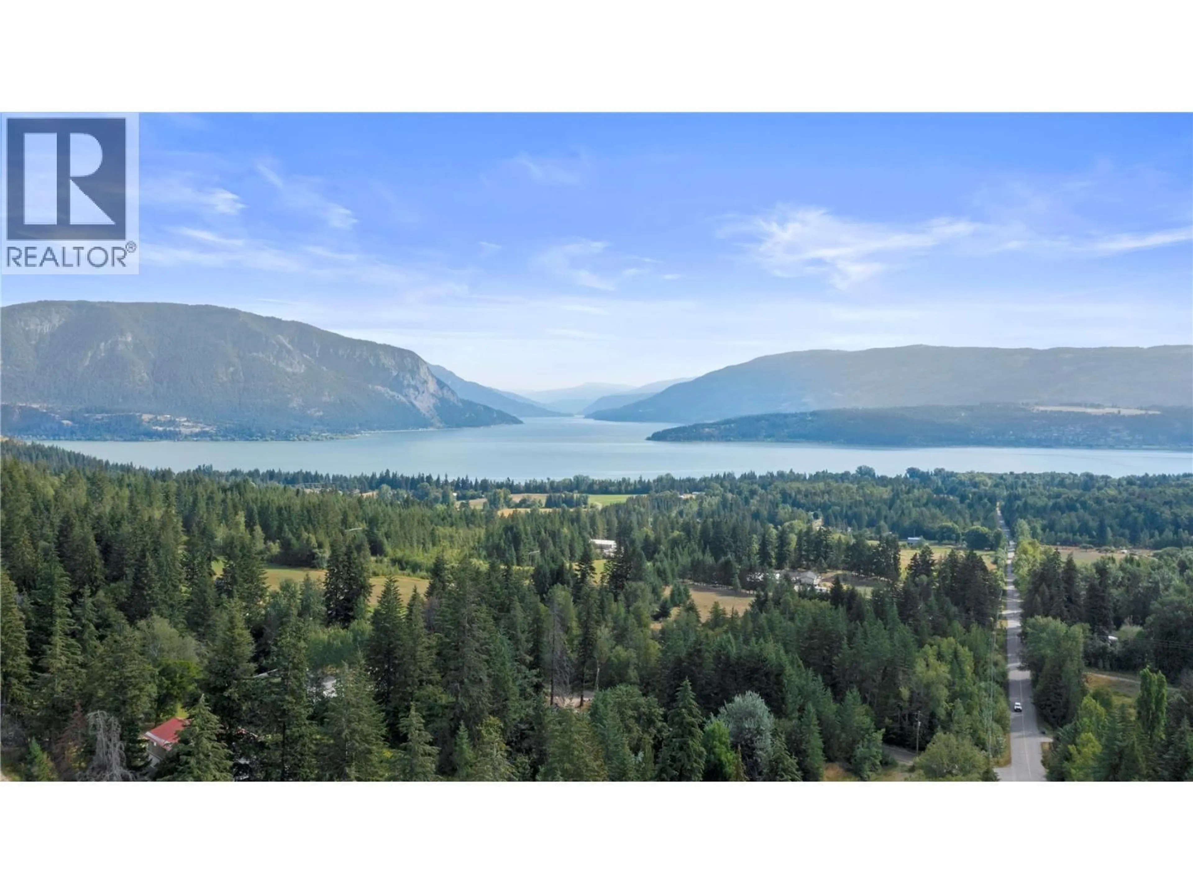 A pic from outside/outdoor area/front of a property/back of a property/a pic from drone, water/lake/river/ocean view for 5121 50 STREET NORTHWEST, Salmon Arm British Columbia V1E3A6