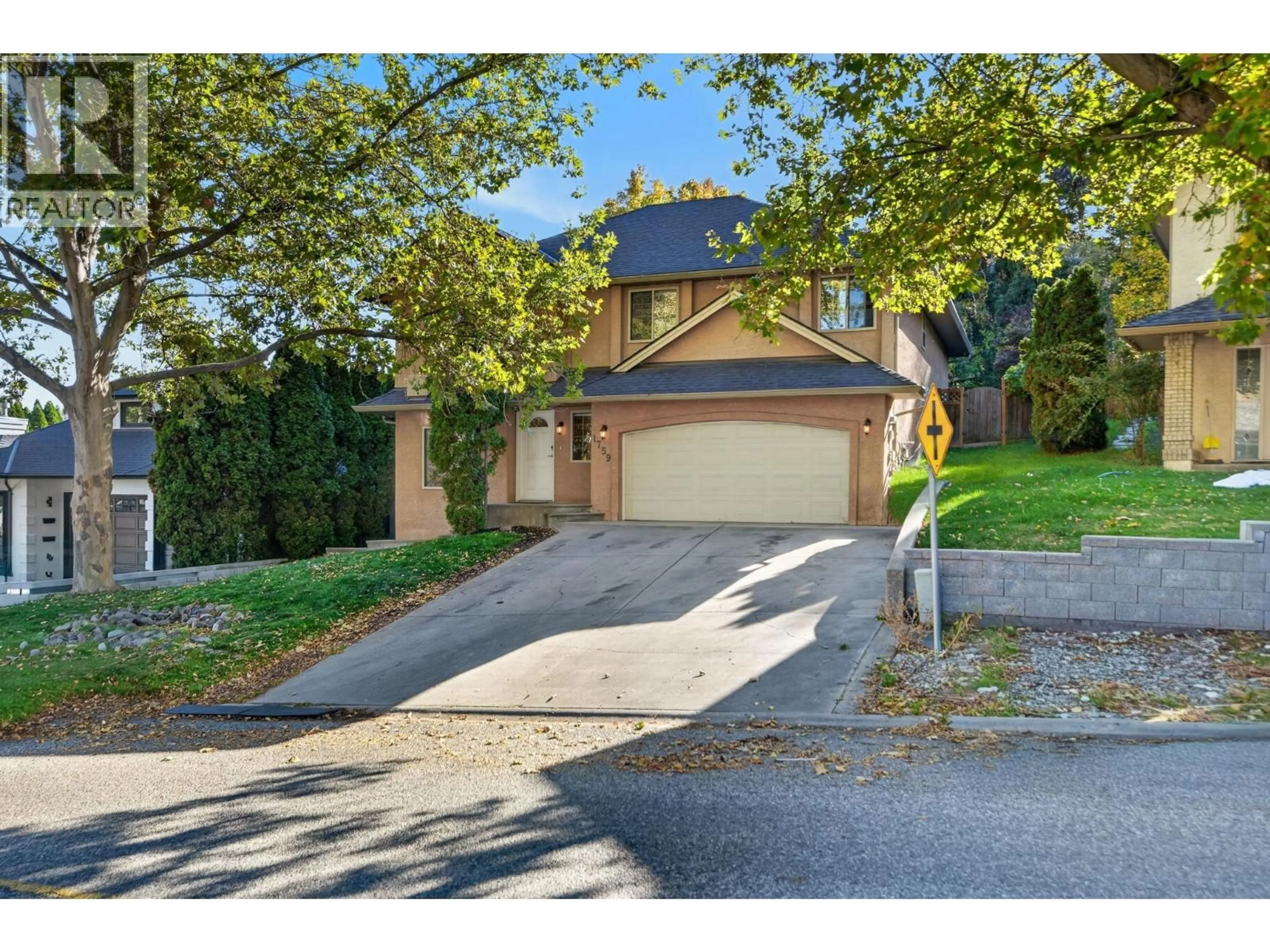 A pic from outside/outdoor area/front of a property/back of a property/a pic from drone, street for 1759 SPRUCEGLEN DRIVE, Kelowna British Columbia V1V1S8