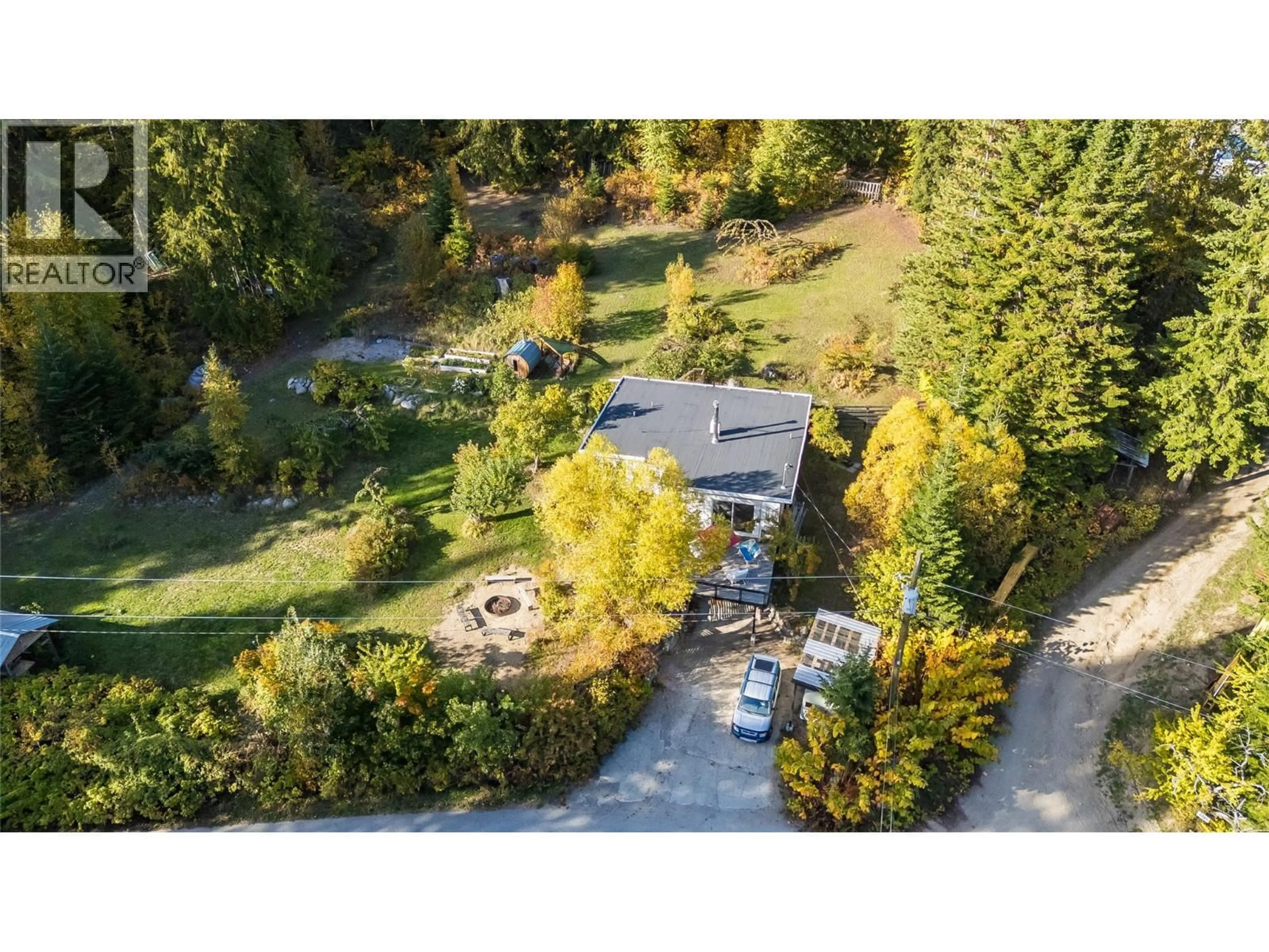 A pic from outside/outdoor area/front of a property/back of a property/a pic from drone, forest/trees view for 5995 LONGBEACH ROAD, Nelson British Columbia V1L6P3