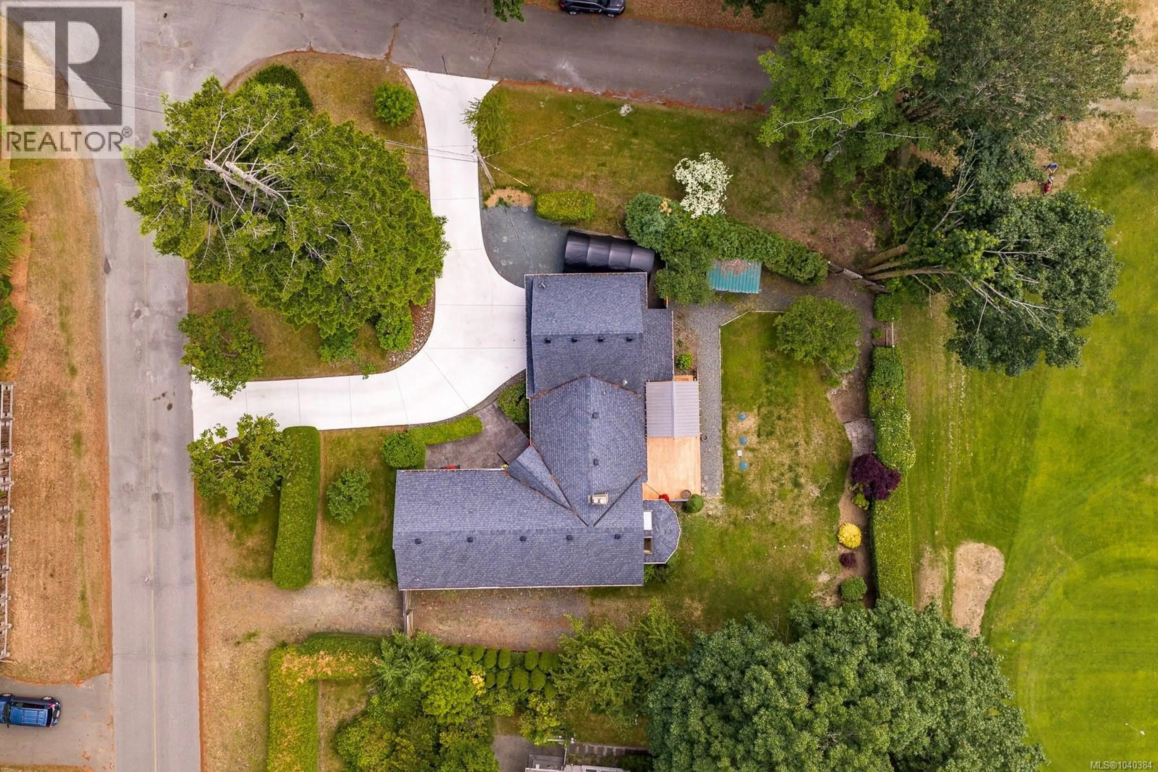 A pic from outside/outdoor area/front of a property/back of a property/a pic from drone, street for 8859 HENDERSON AVENUE, Black Creek British Columbia V9J1A6