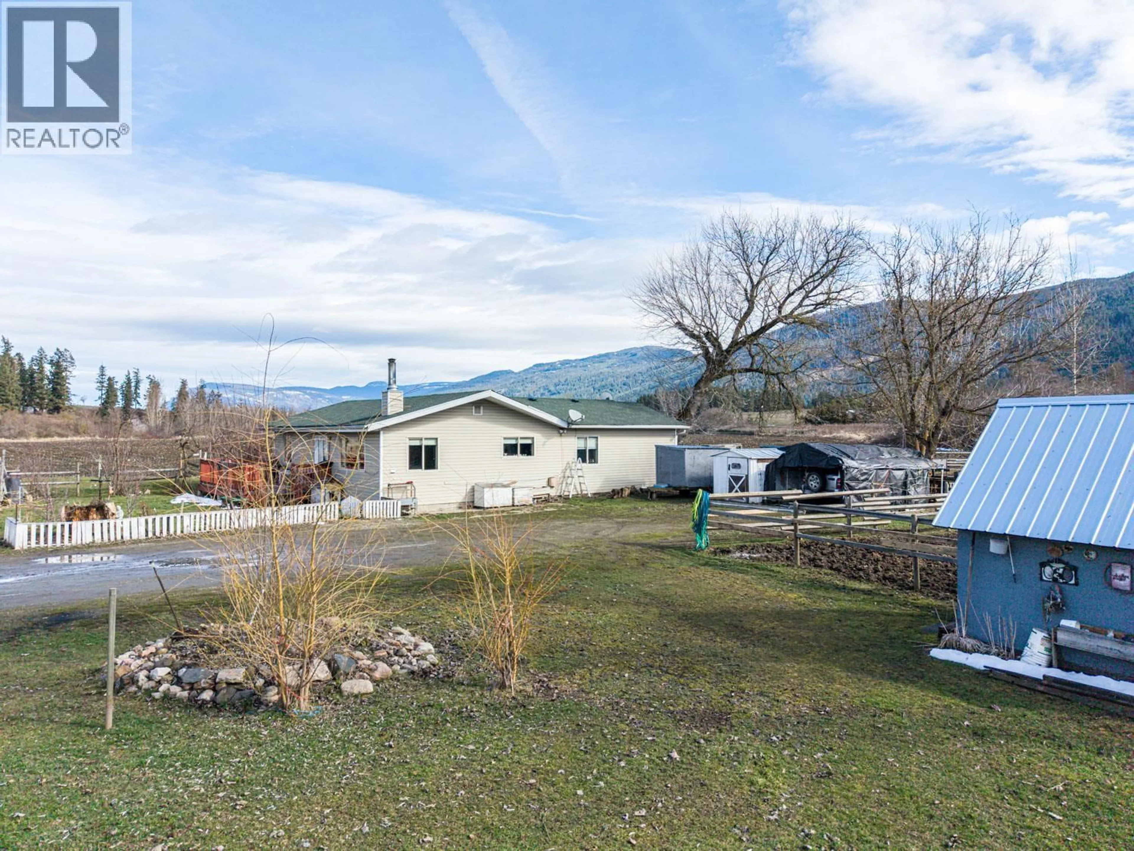 A pic from outside/outdoor area/front of a property/back of a property/a pic from drone, mountain view for 4536 97A HIGHWAY, Spallumcheen British Columbia V4Y0S1