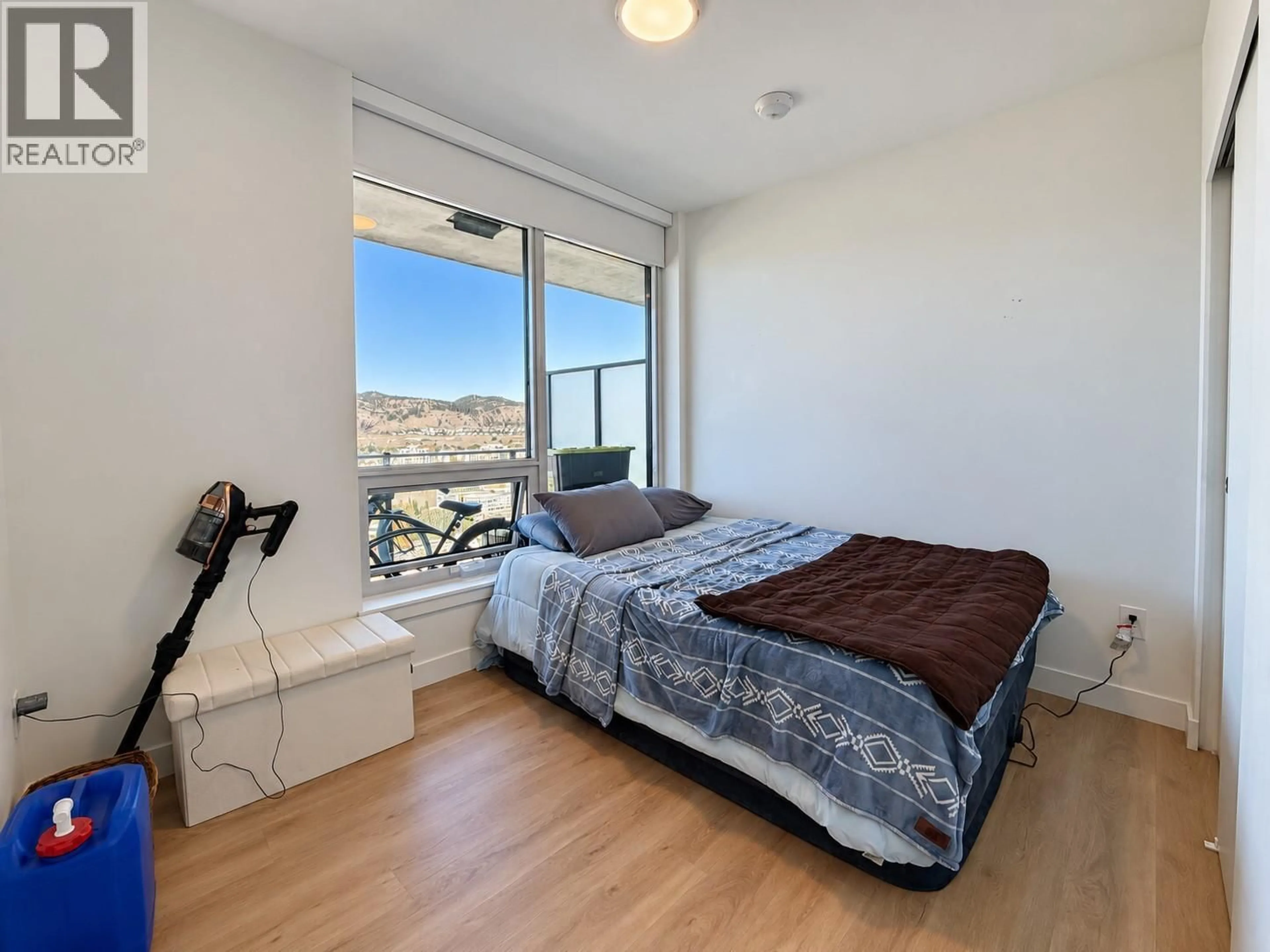 Bedroom with bed, wood/laminate floor for 2109 - 1626 WATER STREET, Kelowna British Columbia V1Y1J9