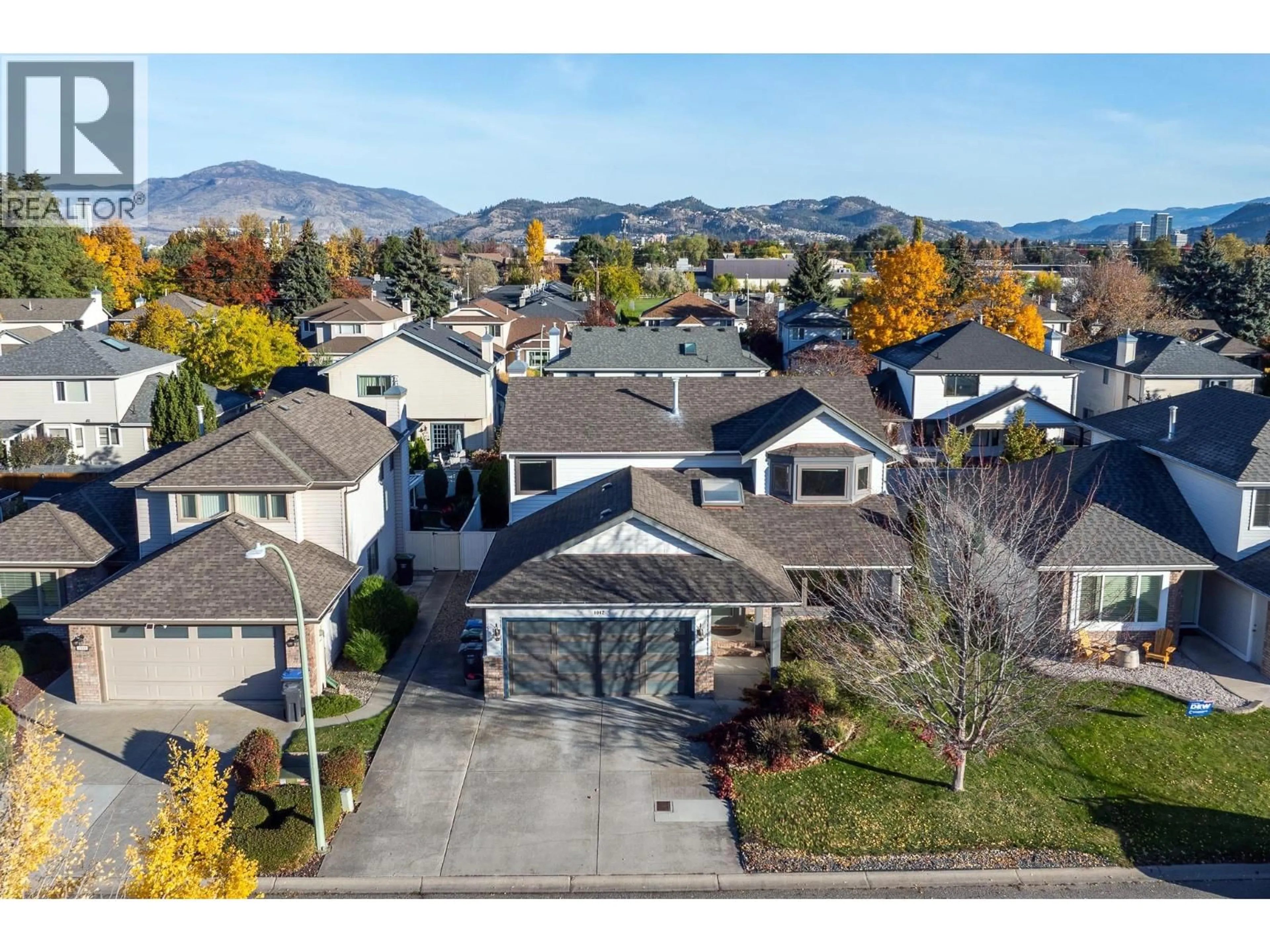 A pic from outside/outdoor area/front of a property/back of a property/a pic from drone, mountain view for 1042 WINTERGREEN DRIVE, Kelowna British Columbia V1Y9A3