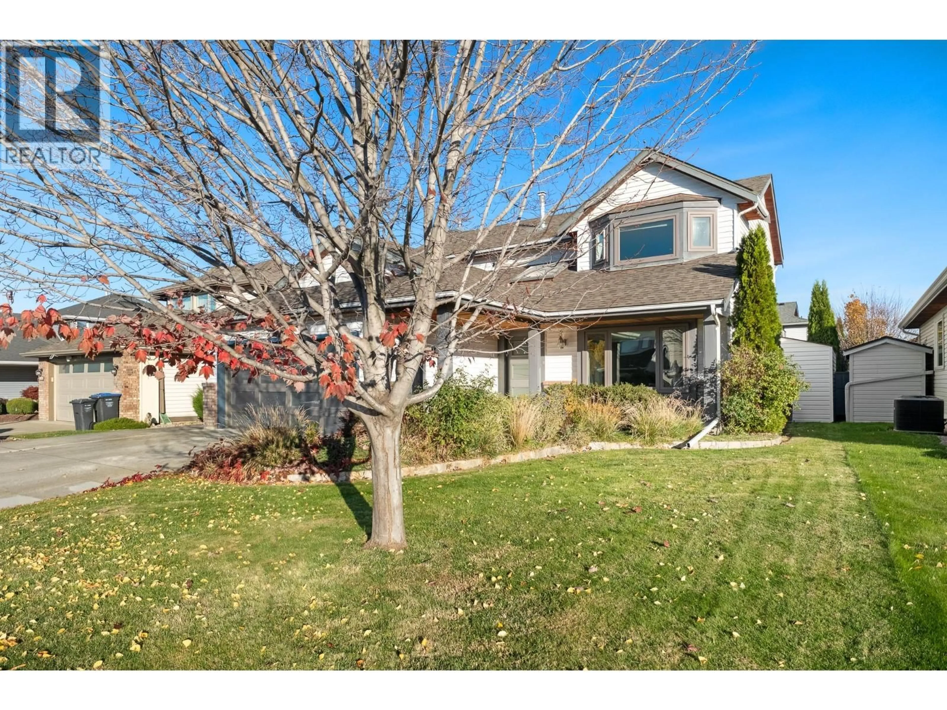 A pic from outside/outdoor area/front of a property/back of a property/a pic from drone, street for 1042 WINTERGREEN DRIVE, Kelowna British Columbia V1Y9A3