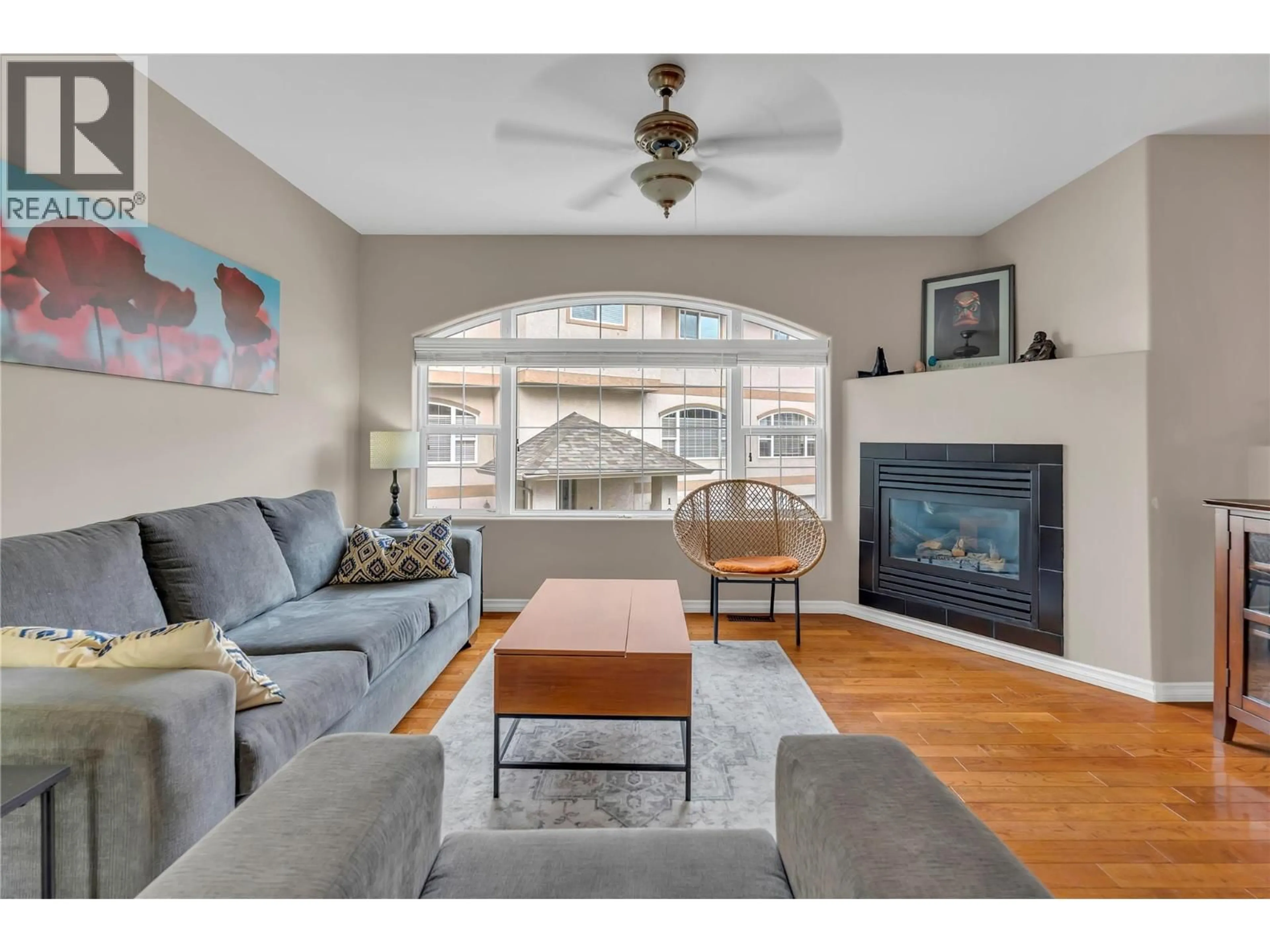 Living room with furniture, wood/laminate floor for 103 - 849 WINNIPEG STREET, Penticton British Columbia V2N5N4